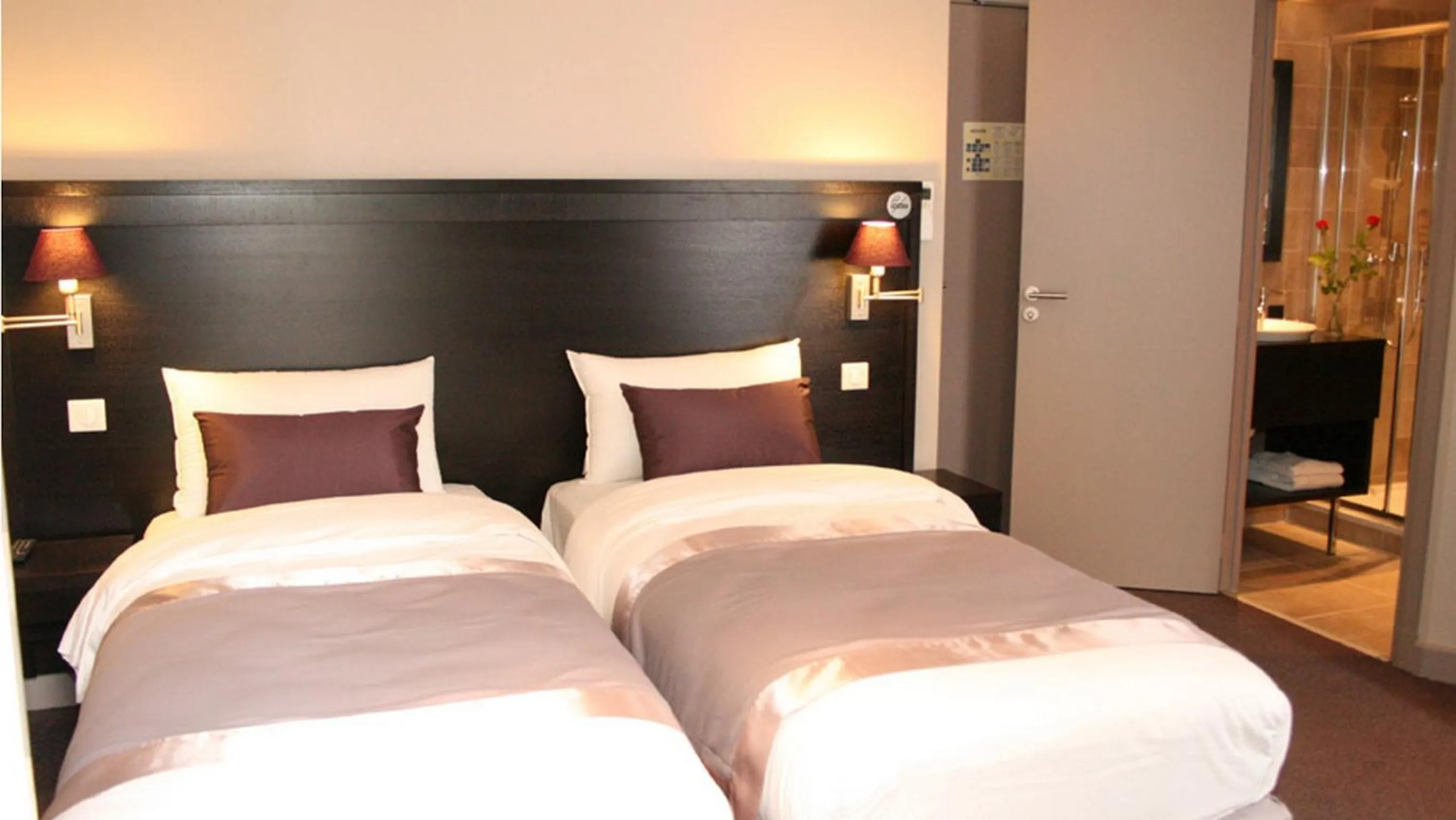 Bed in La Place Boutique Hotel