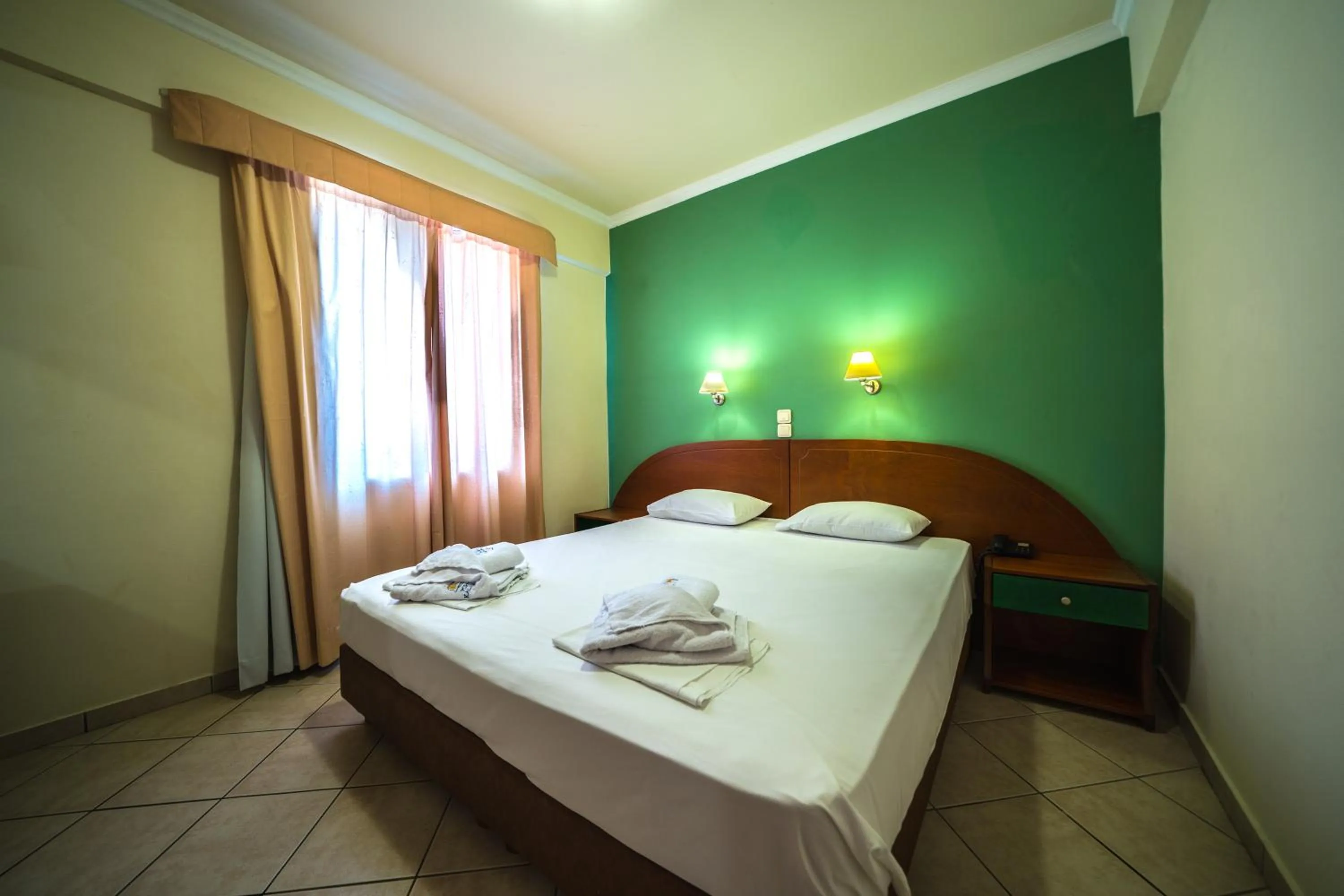 Bed in Porto Kalamaki Hotel