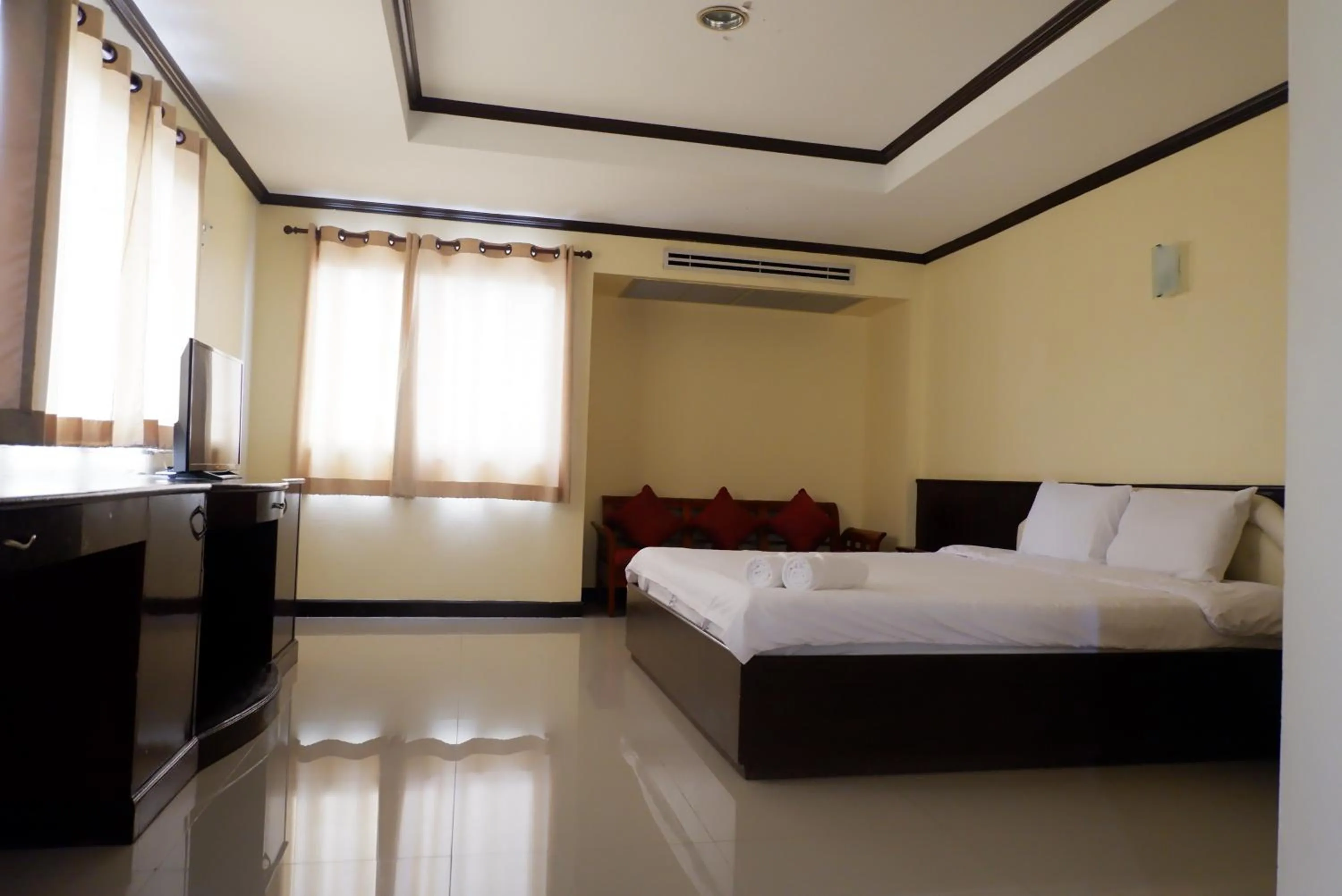 Bed in Auychai Grand Hotel