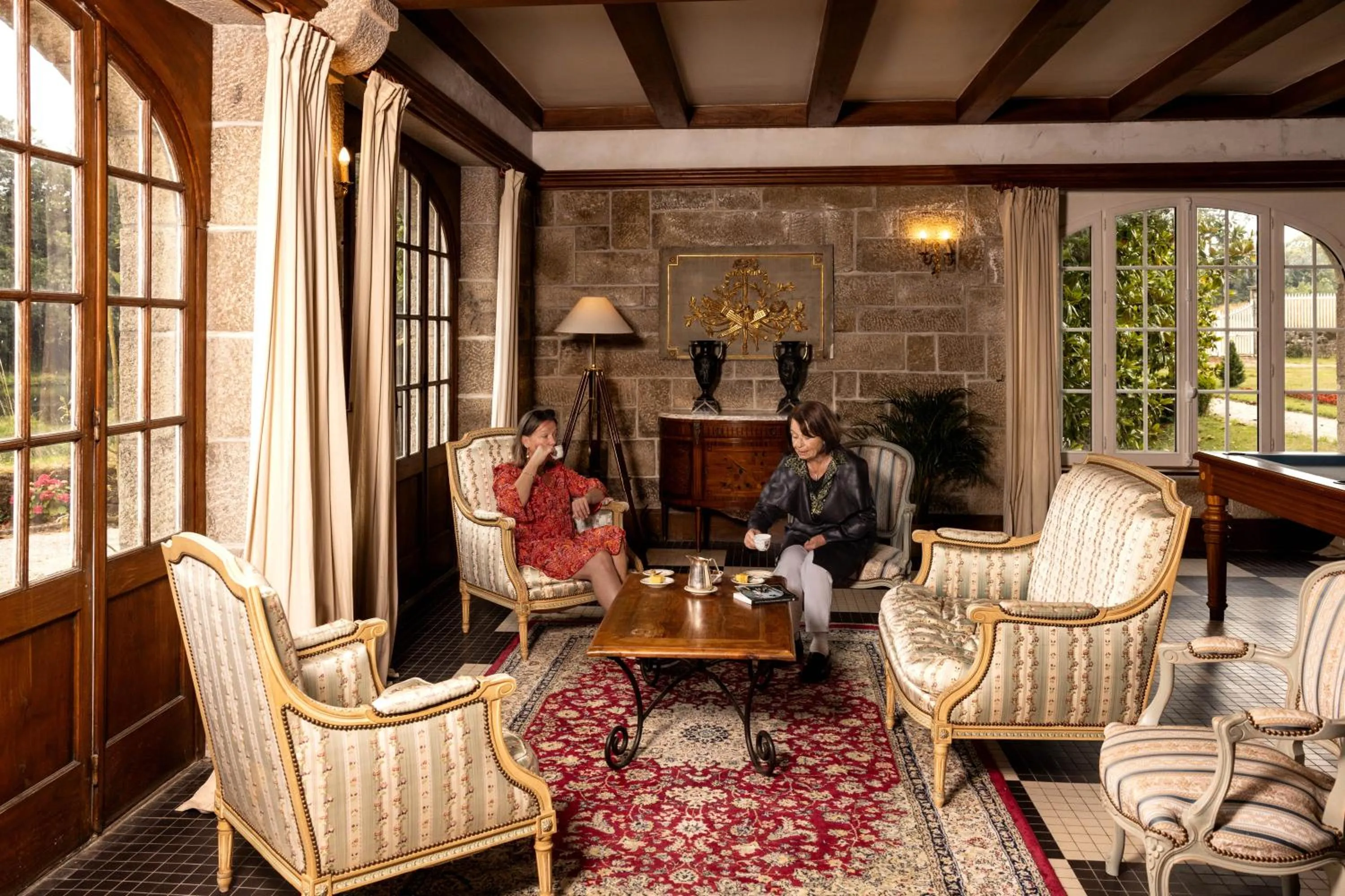 Communal lounge/ TV room in Manoir Du Stang