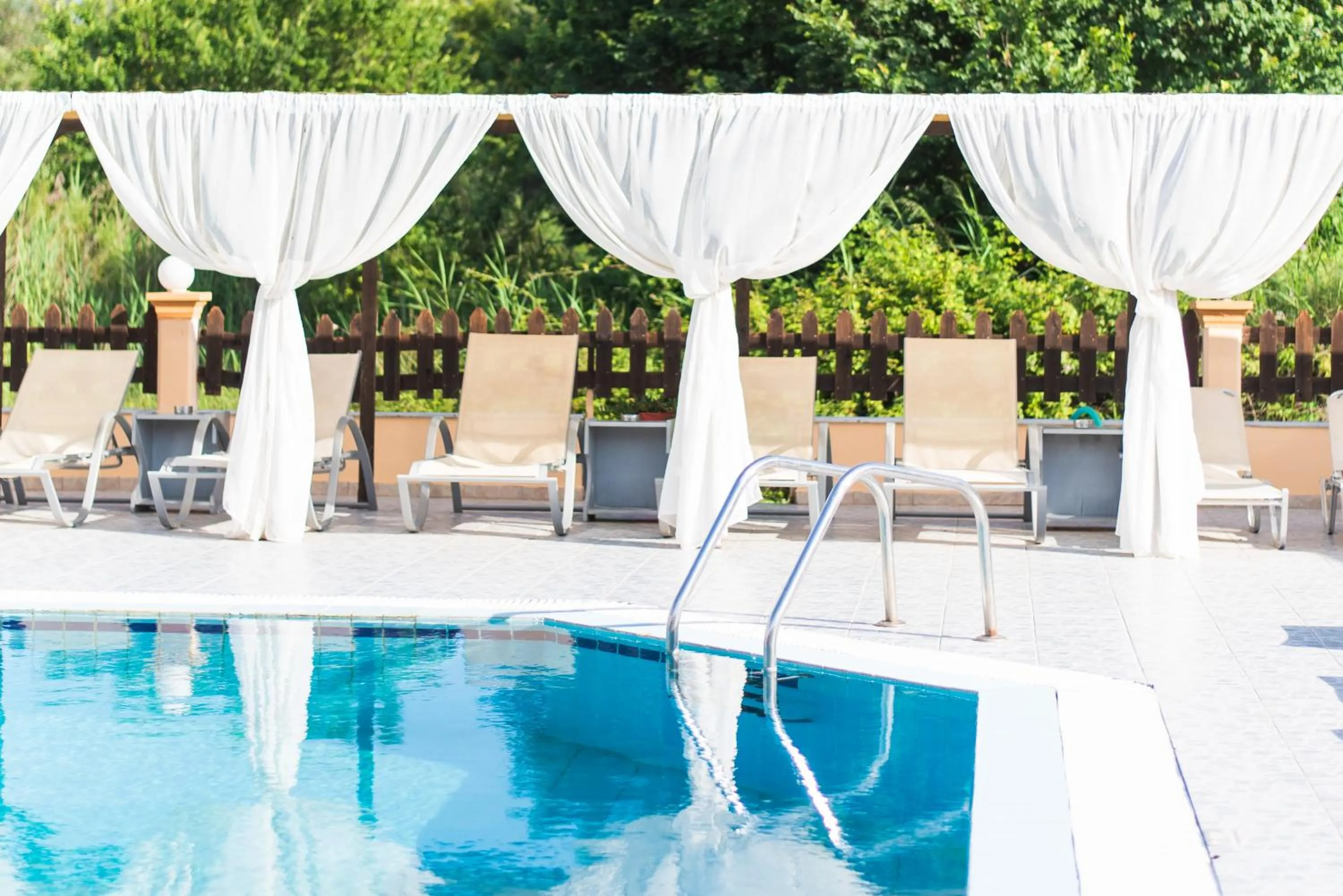 Patio in Sandy Beach Complex - Poolside Studios & Seaside Apartments