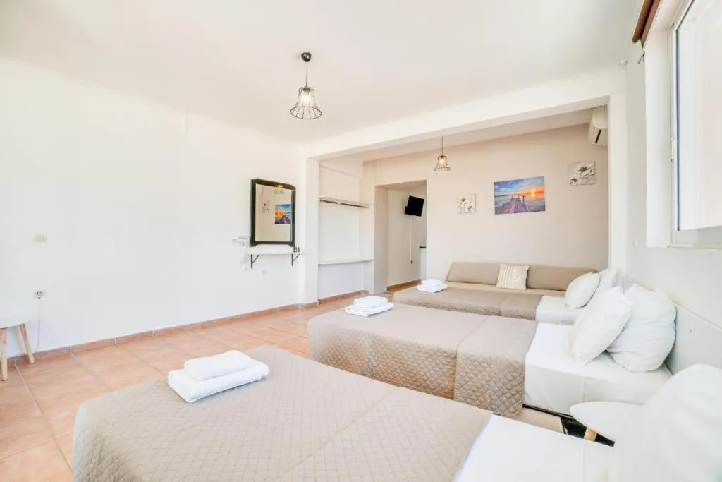 Bed in Sandy Beach Complex - Poolside Studios & Seaside Apartments