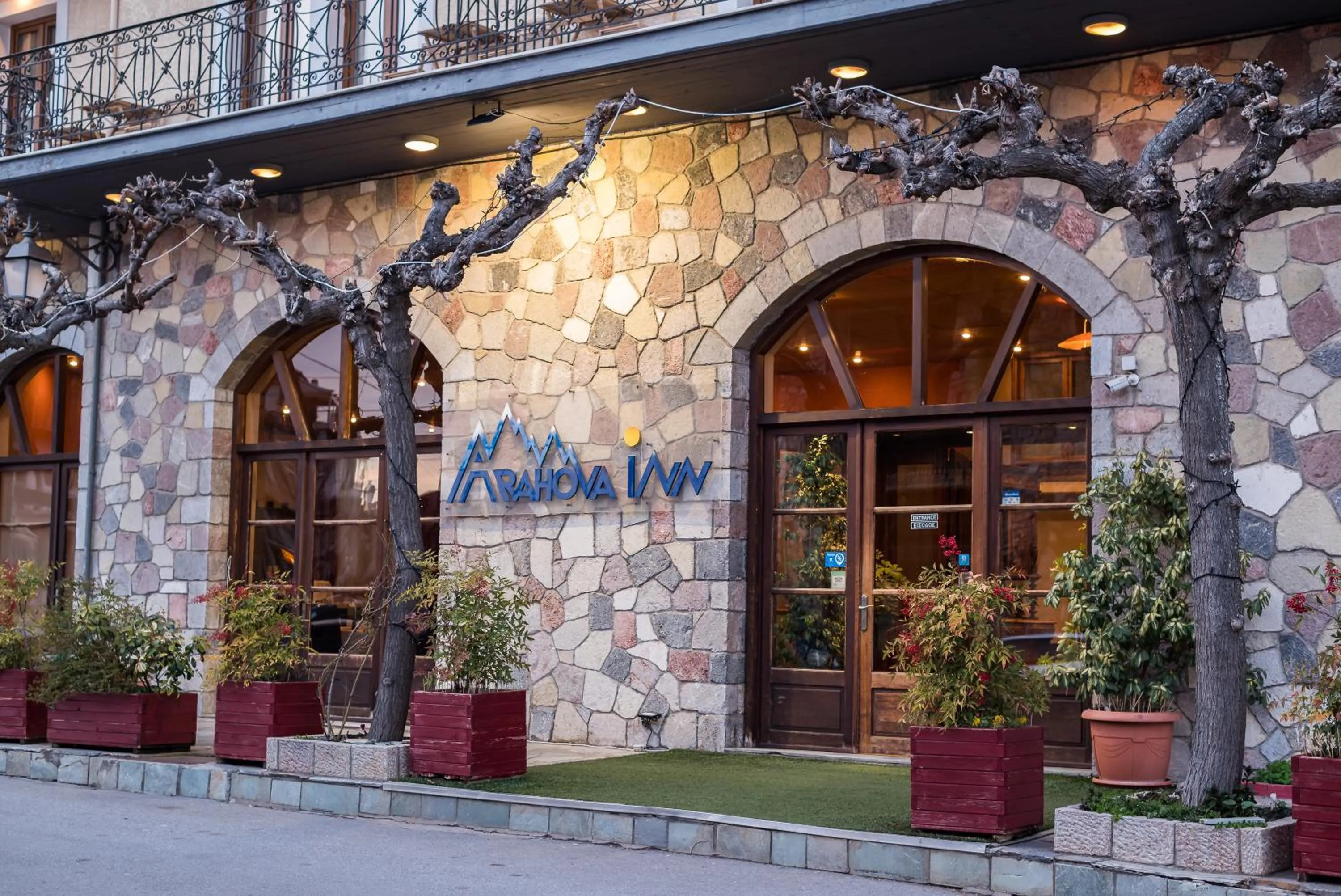 Property logo or sign in Arahova Inn Hotel