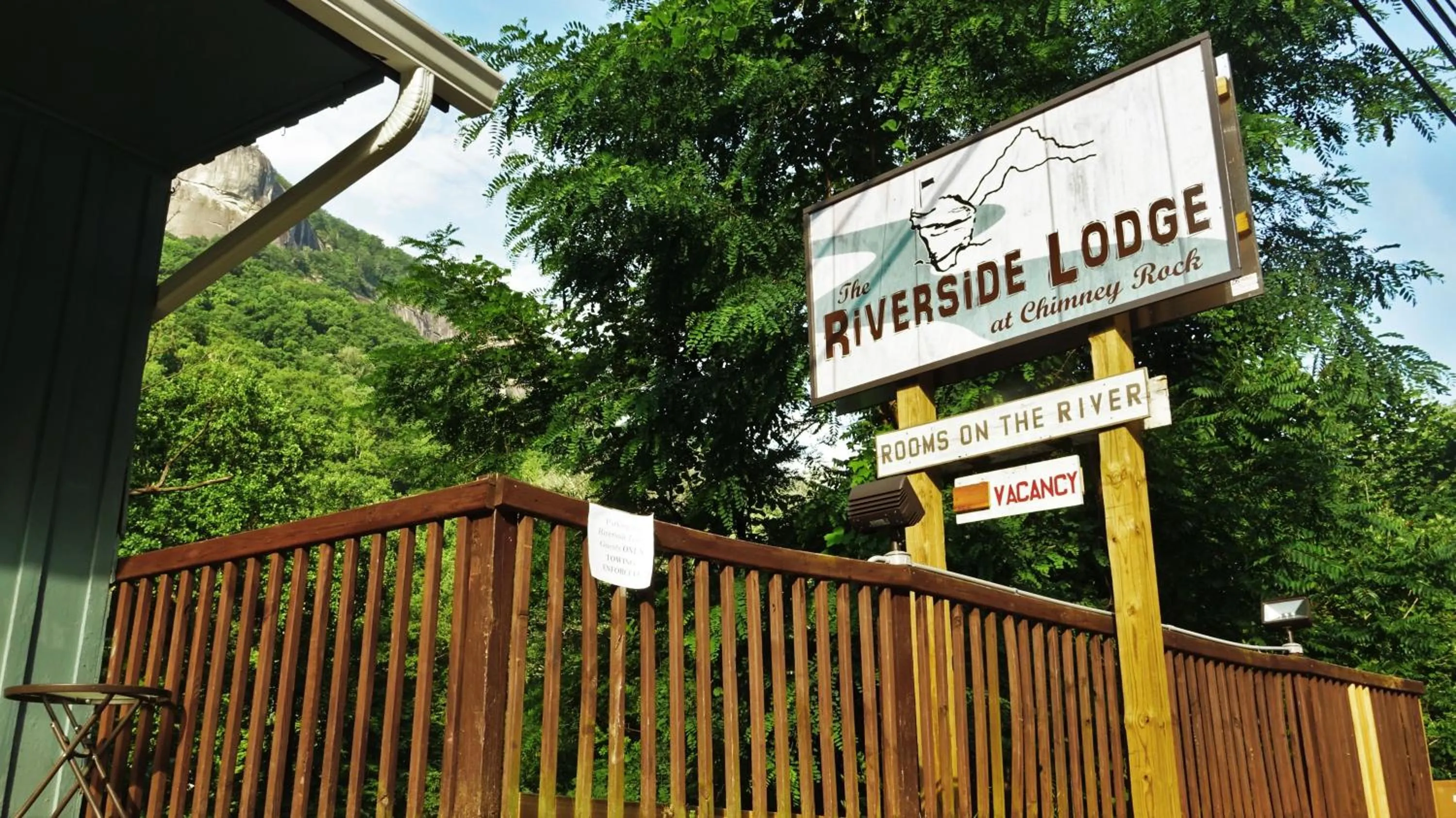 Property logo or sign in Riverside Lodge at Chimney Rock