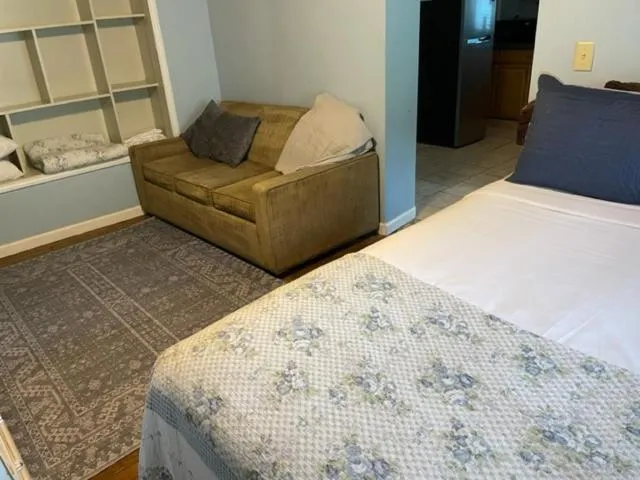 Seating area, Bed in Riverside Lodge at Chimney Rock