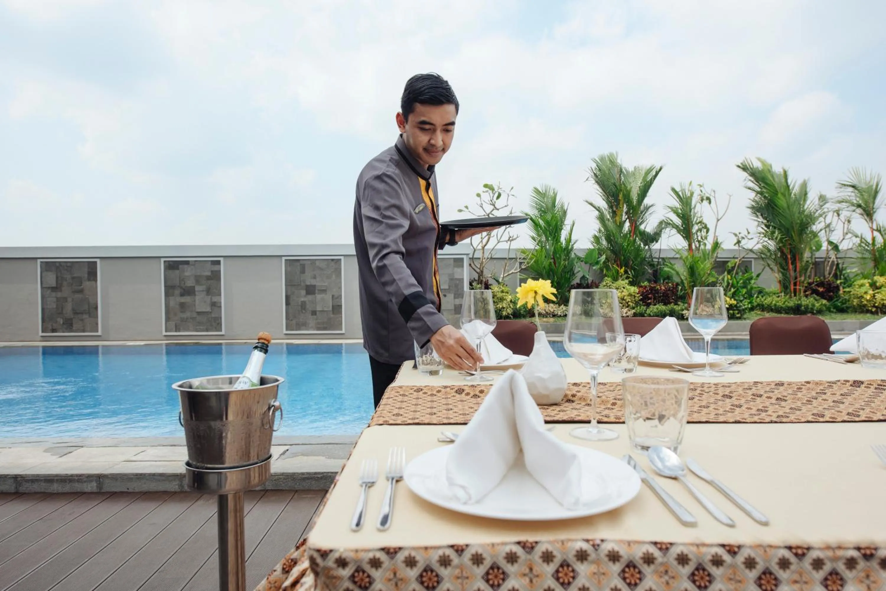 Swimming pool in GRAMM HOTEL by Ambarrukmo Yogyakarta