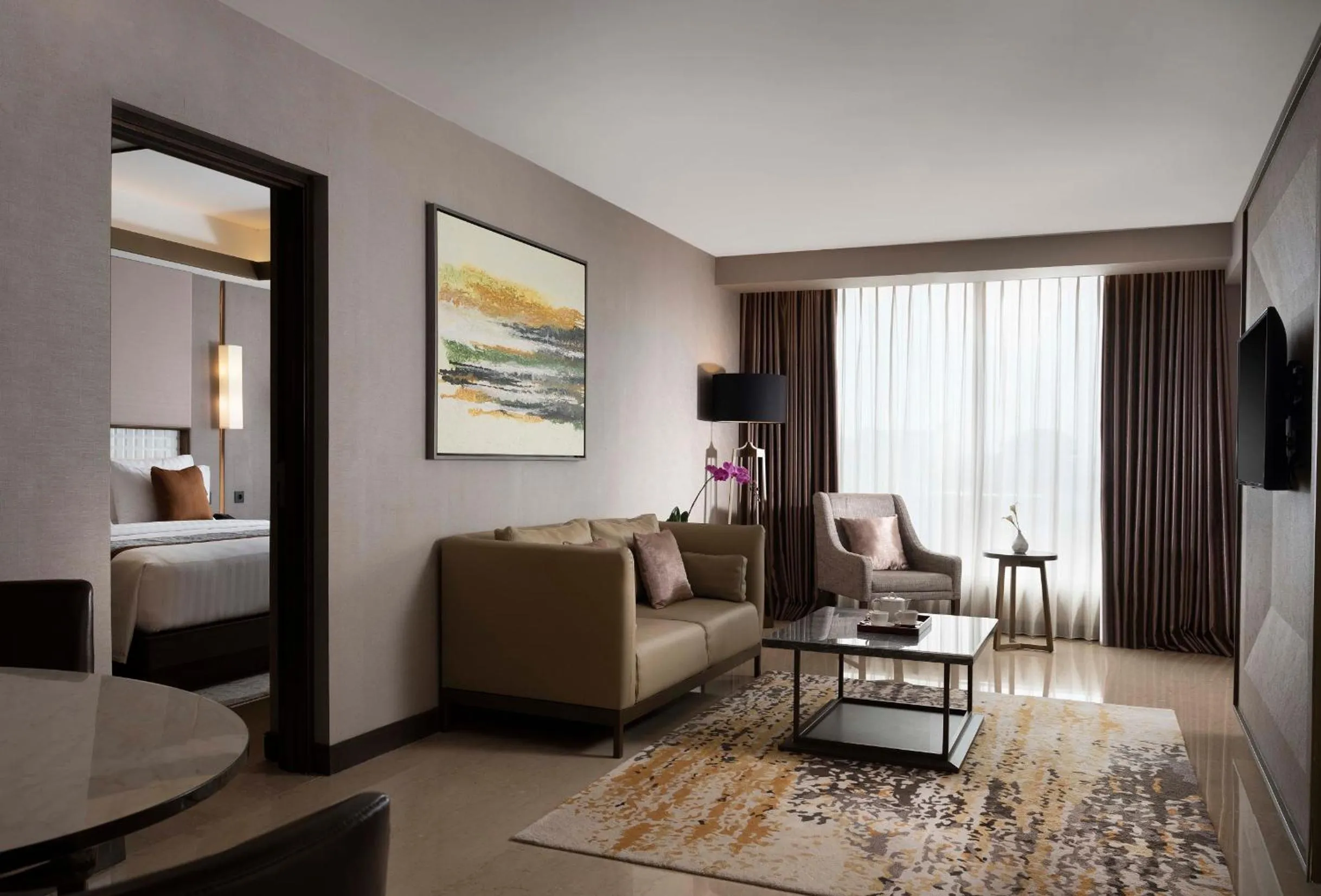 Bed in GRAMM HOTEL by Ambarrukmo Yogyakarta