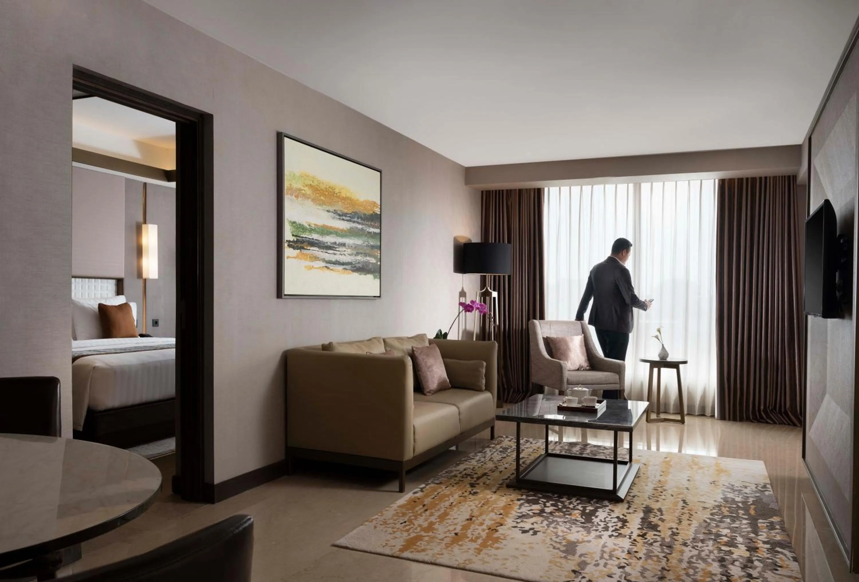 Bed in GRAMM HOTEL by Ambarrukmo Yogyakarta