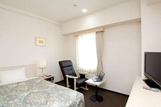 Bedroom, Bed in Hotel Unisite Mutsu