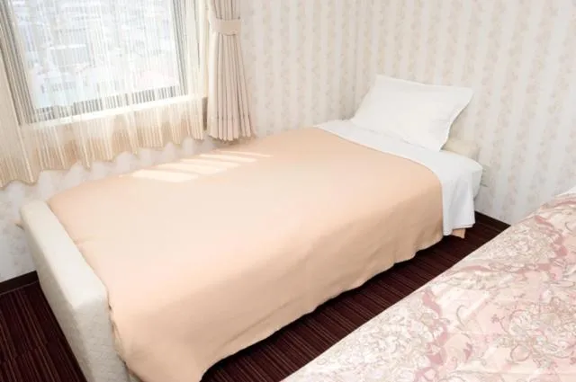 Bedroom, Bed in Hotel Unisite Mutsu