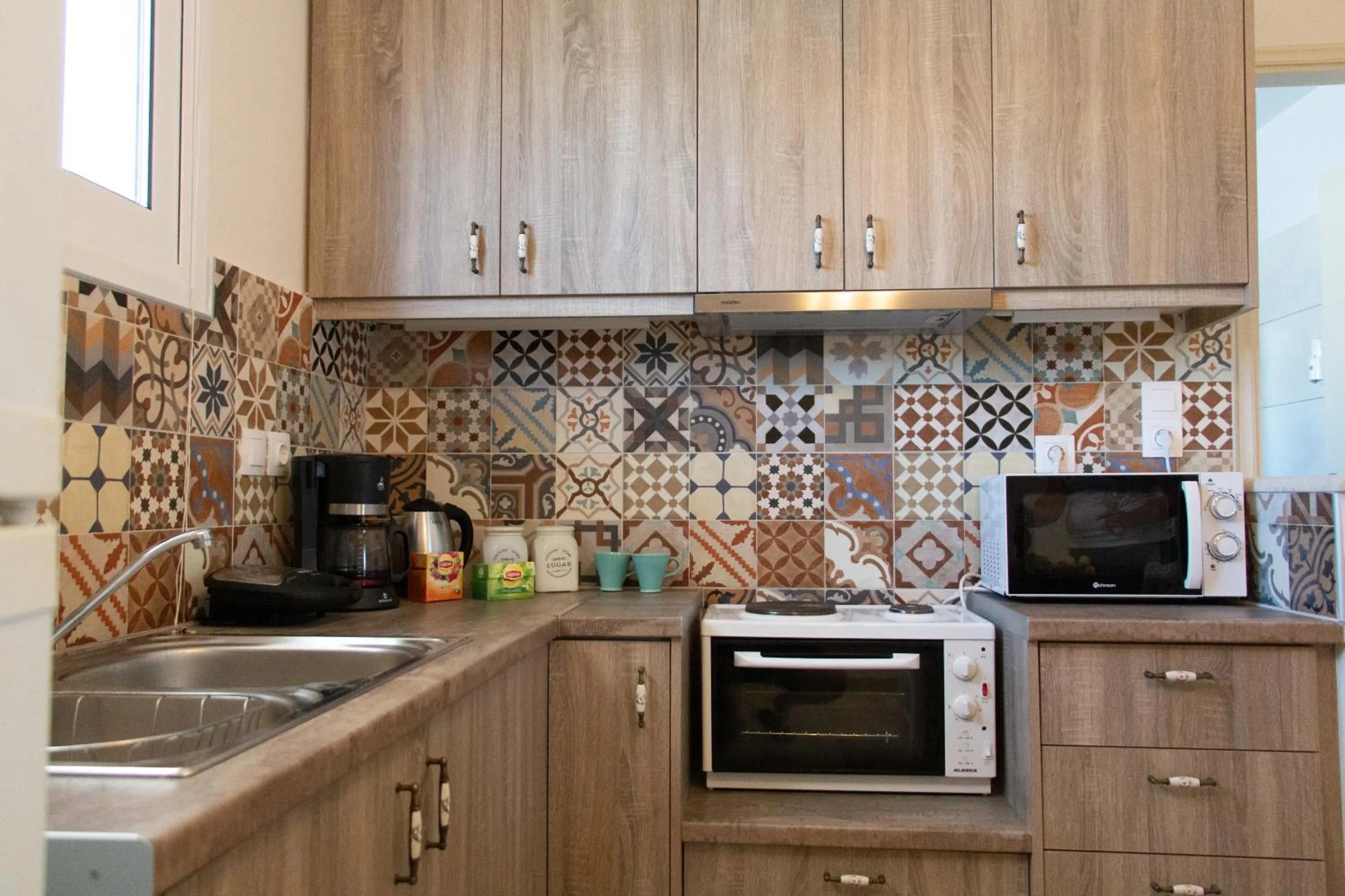 Kitchen or kitchenette in Helen Hotel