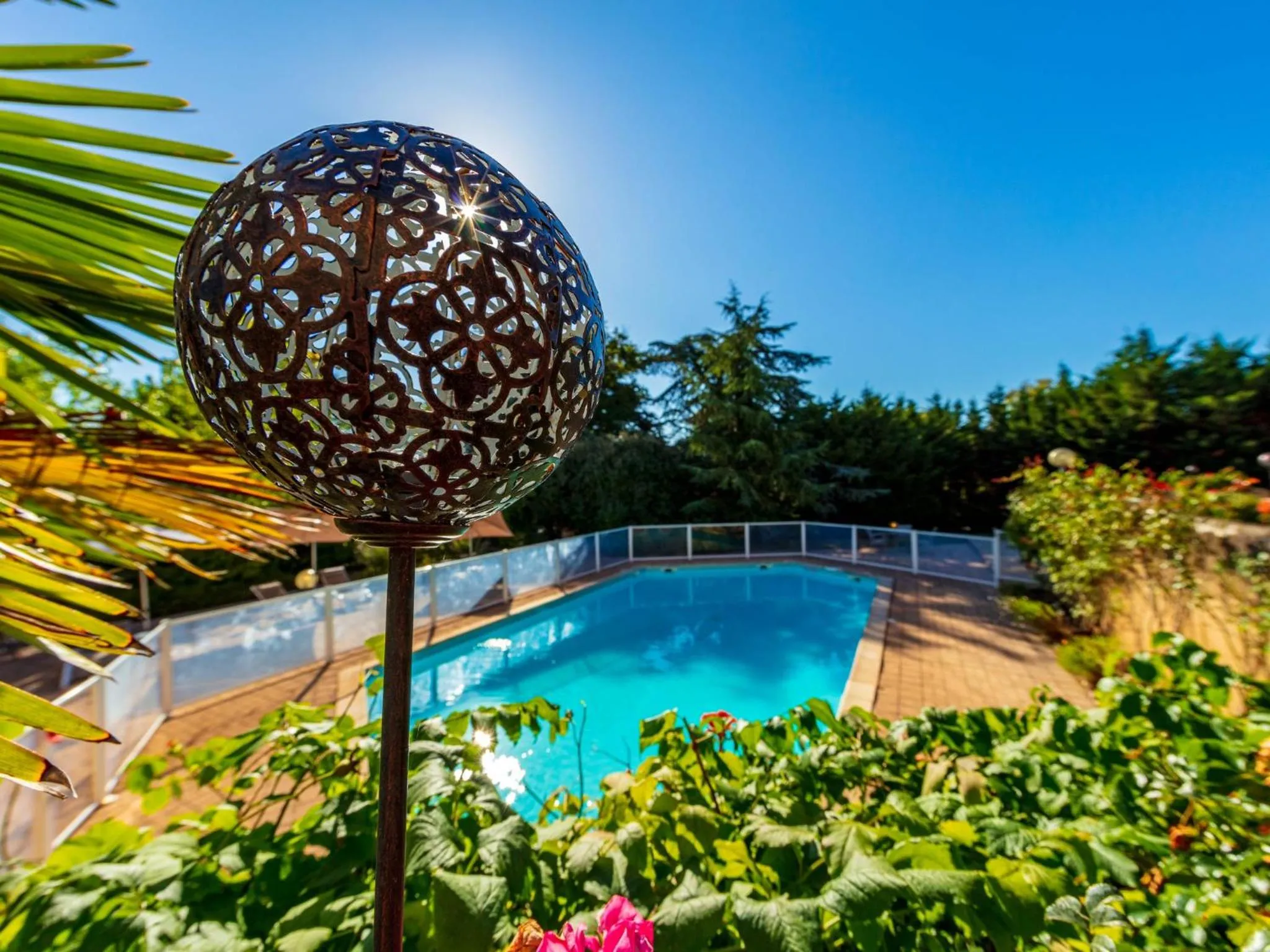 Swimming pool in Logis Hotel Noemys Morgon