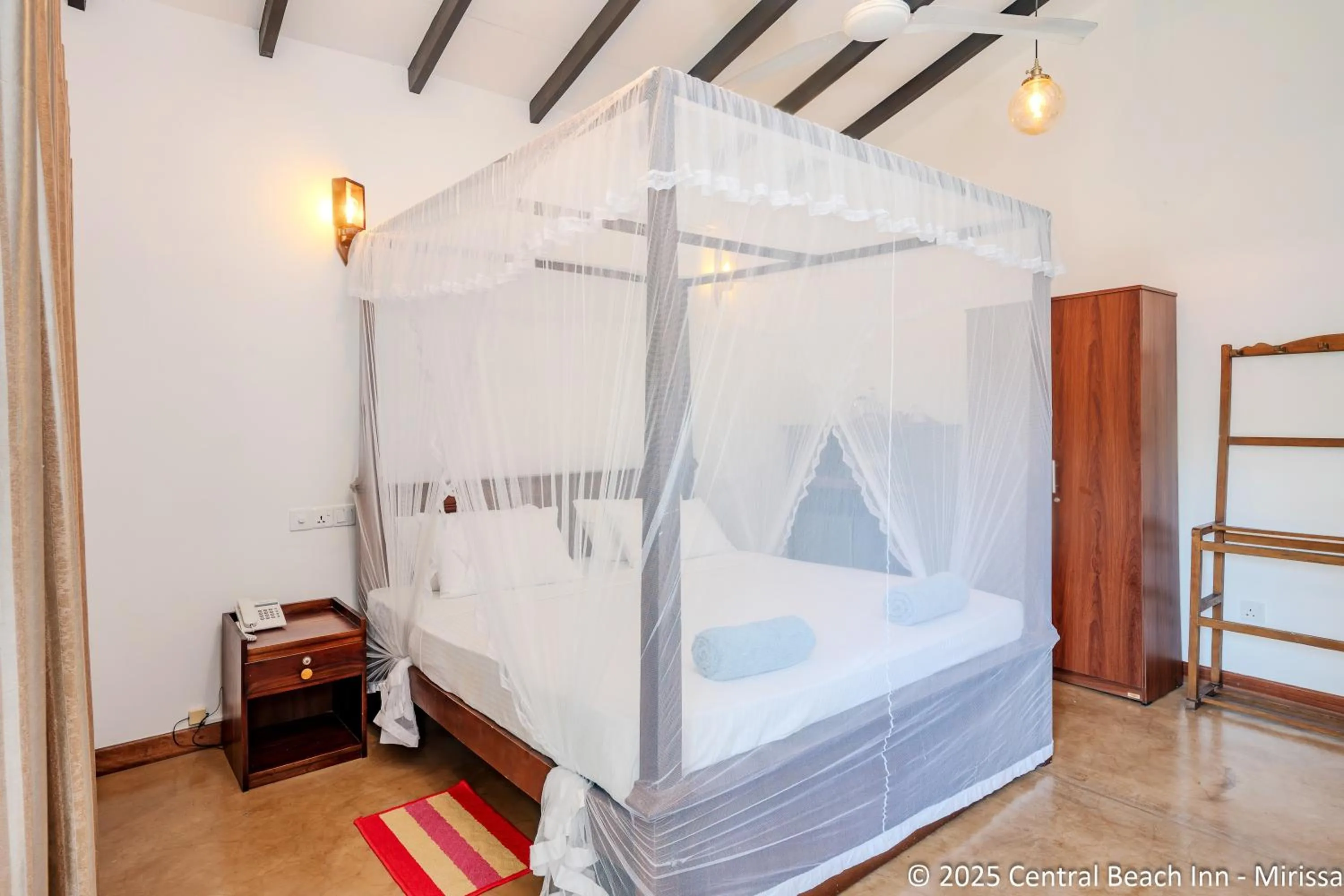 Bed in Central Beach Inn