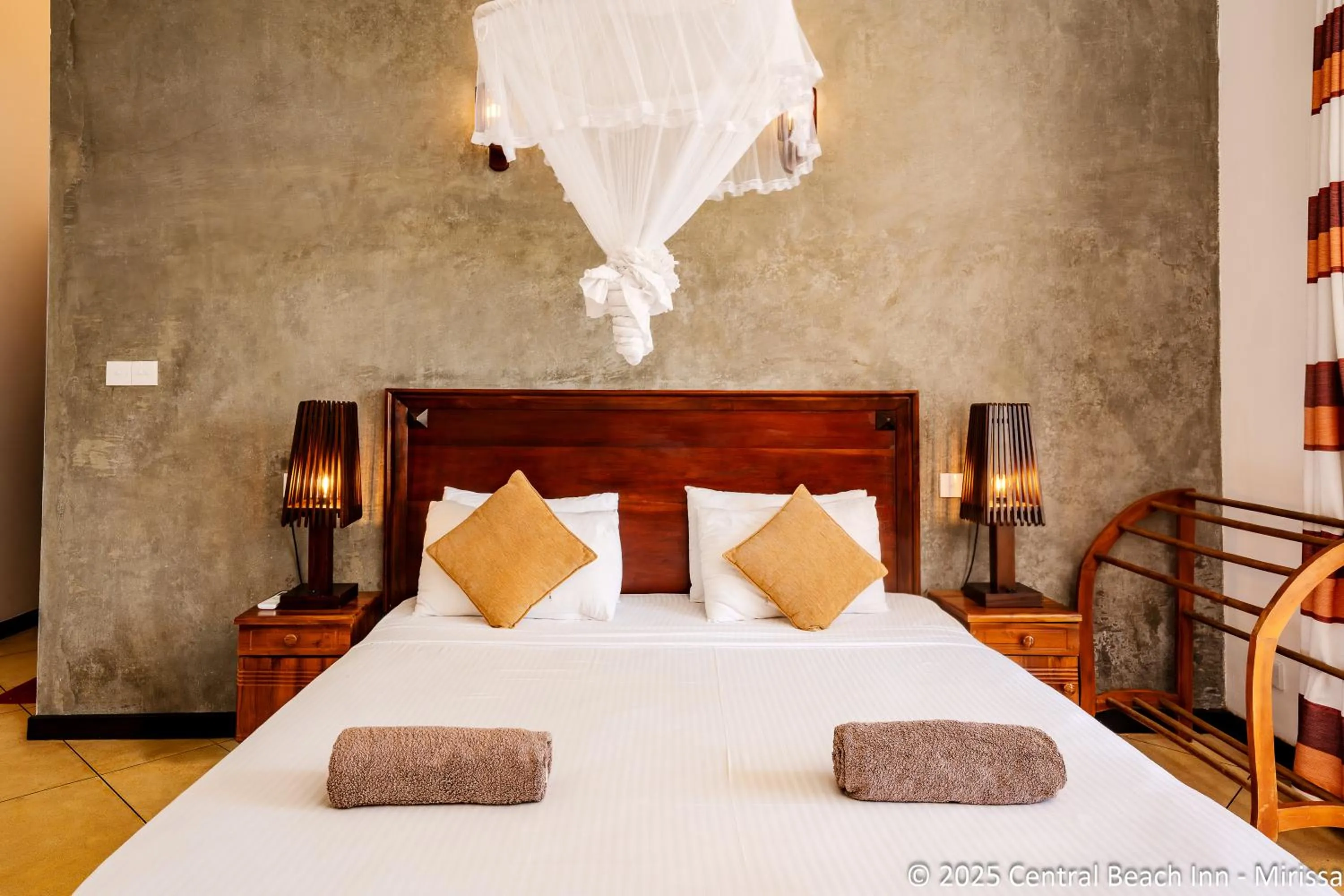 Bed in Central Beach Inn