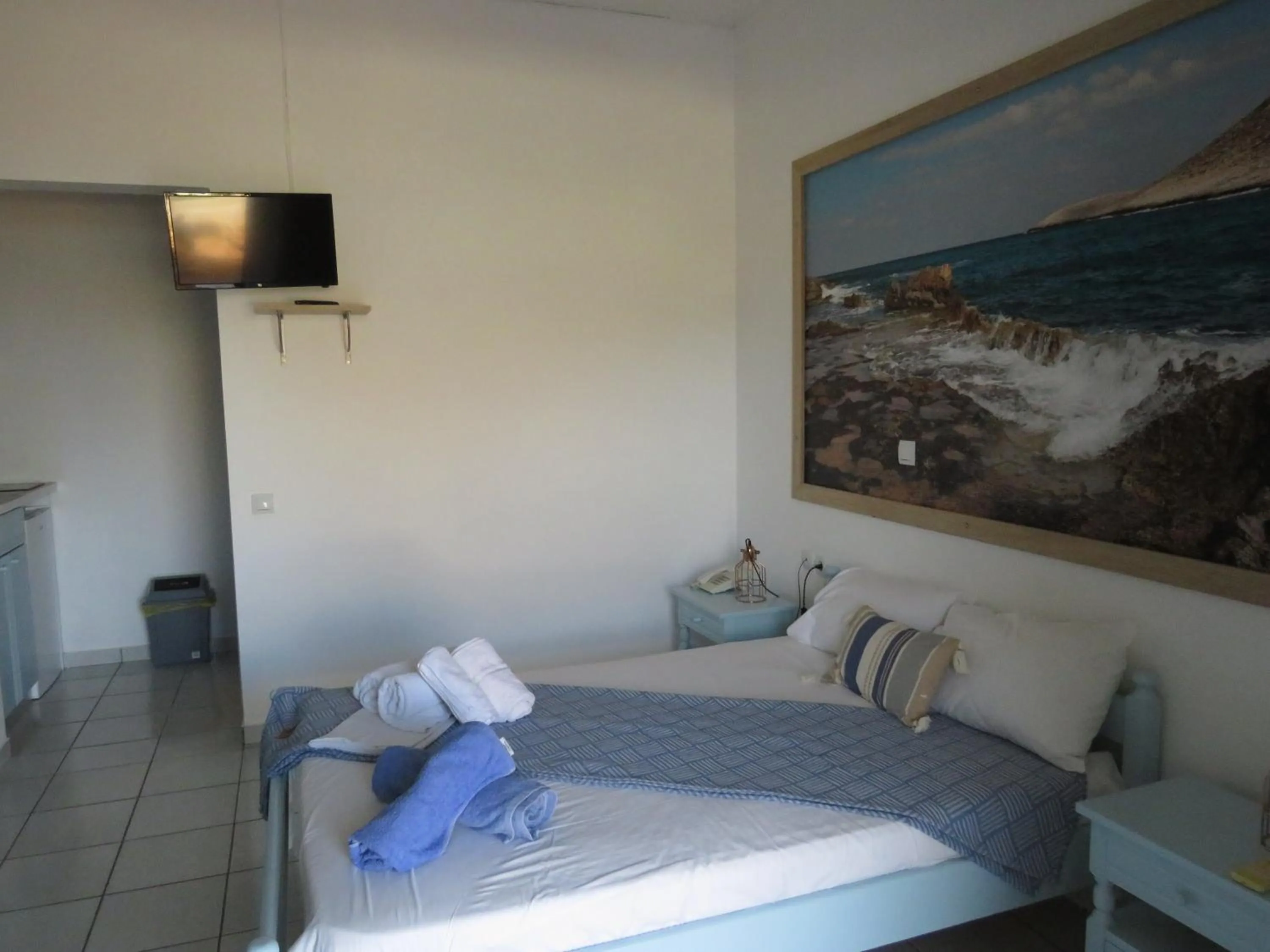 Bed in Blue Beach Villas Apartments