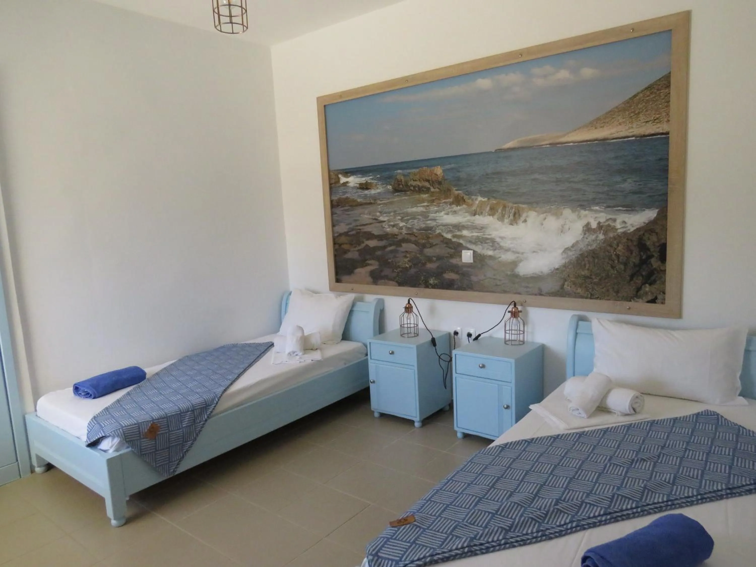 Bed in Blue Beach Villas Apartments