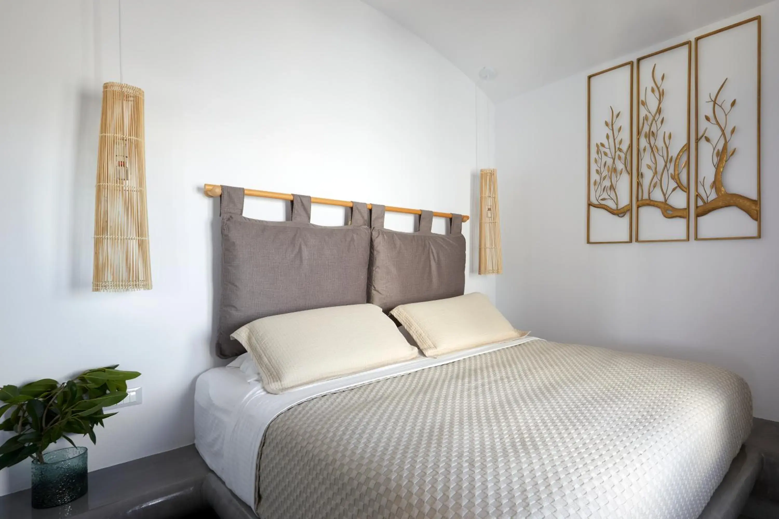 Bed in Oia Suites Bed in Oia Suites