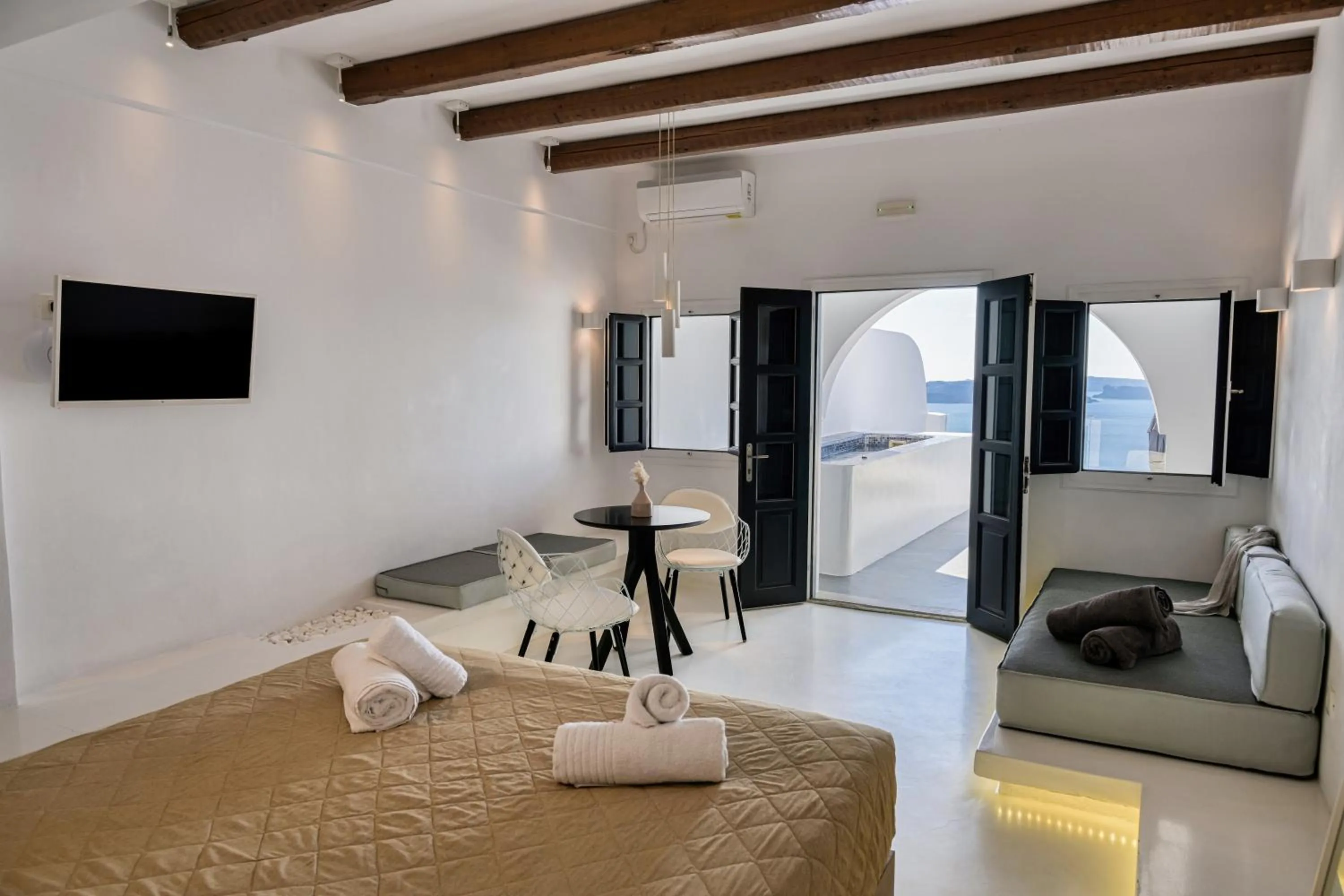 Seating area, Bed in Oia Suites