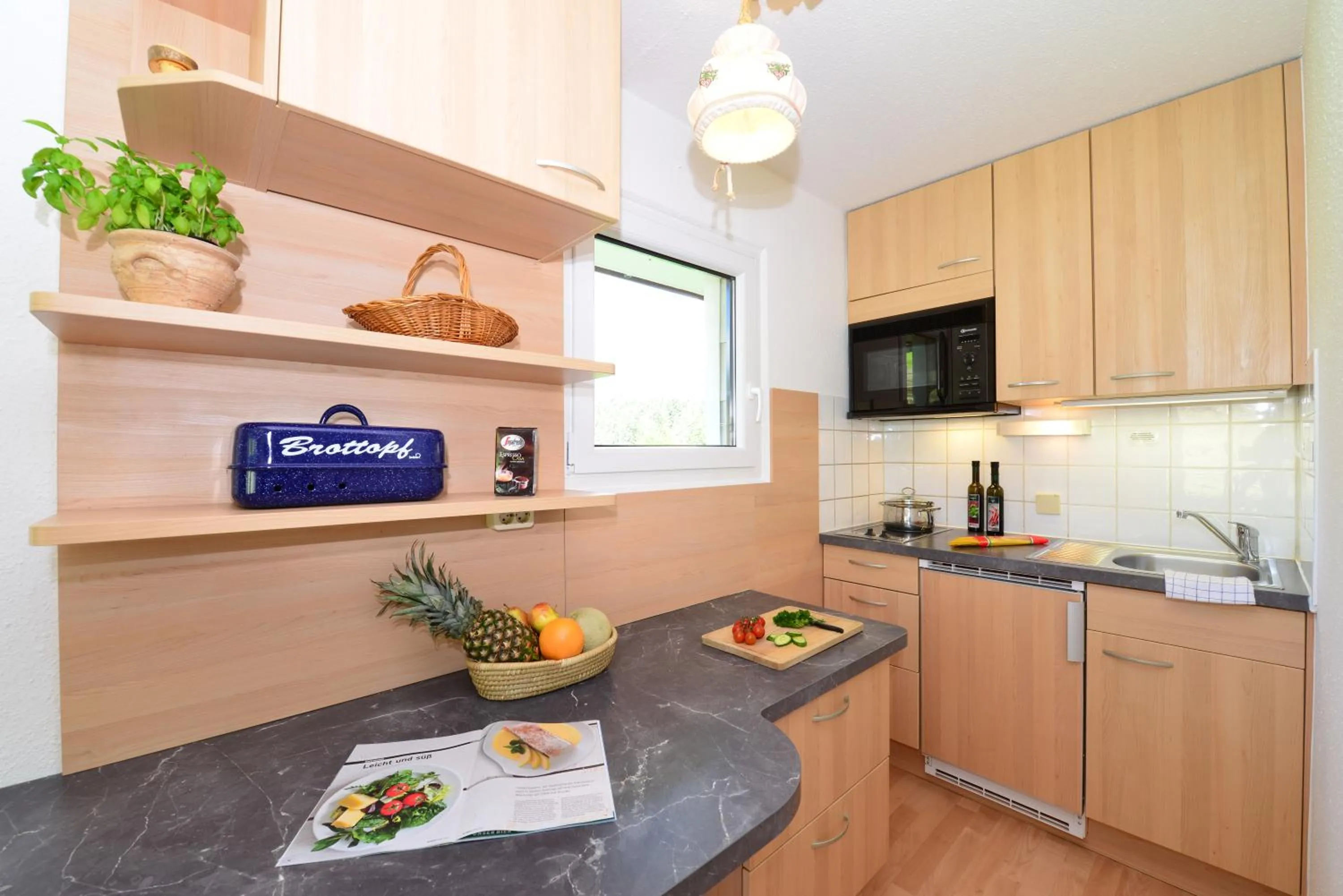 Kitchen or kitchenette in Familienhotel Kleinwalsertal