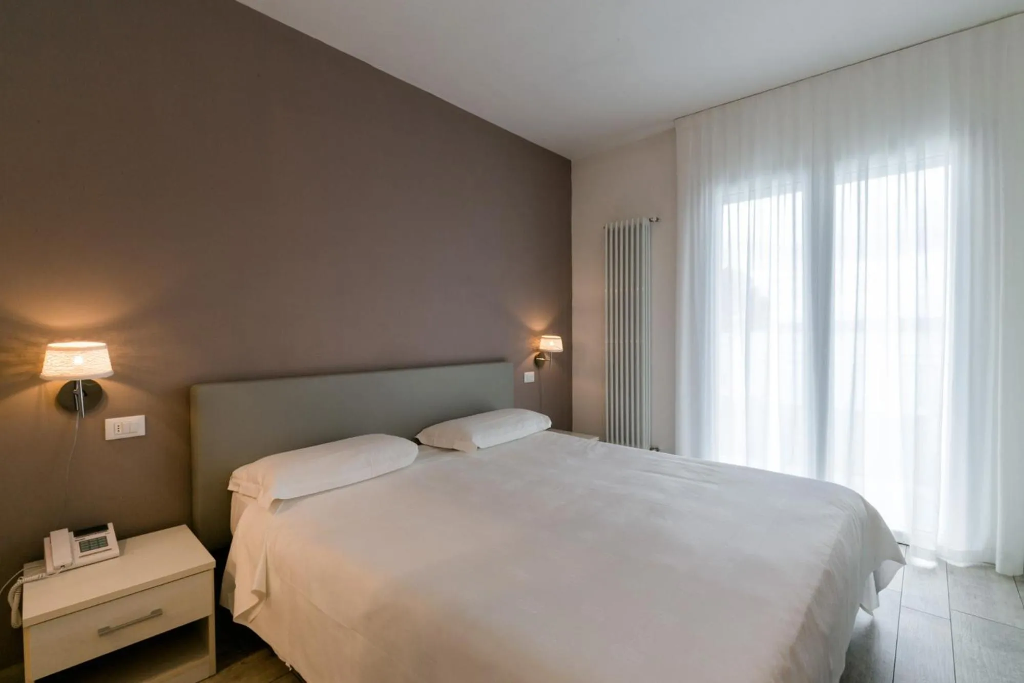 Bed in Hotel Saviola