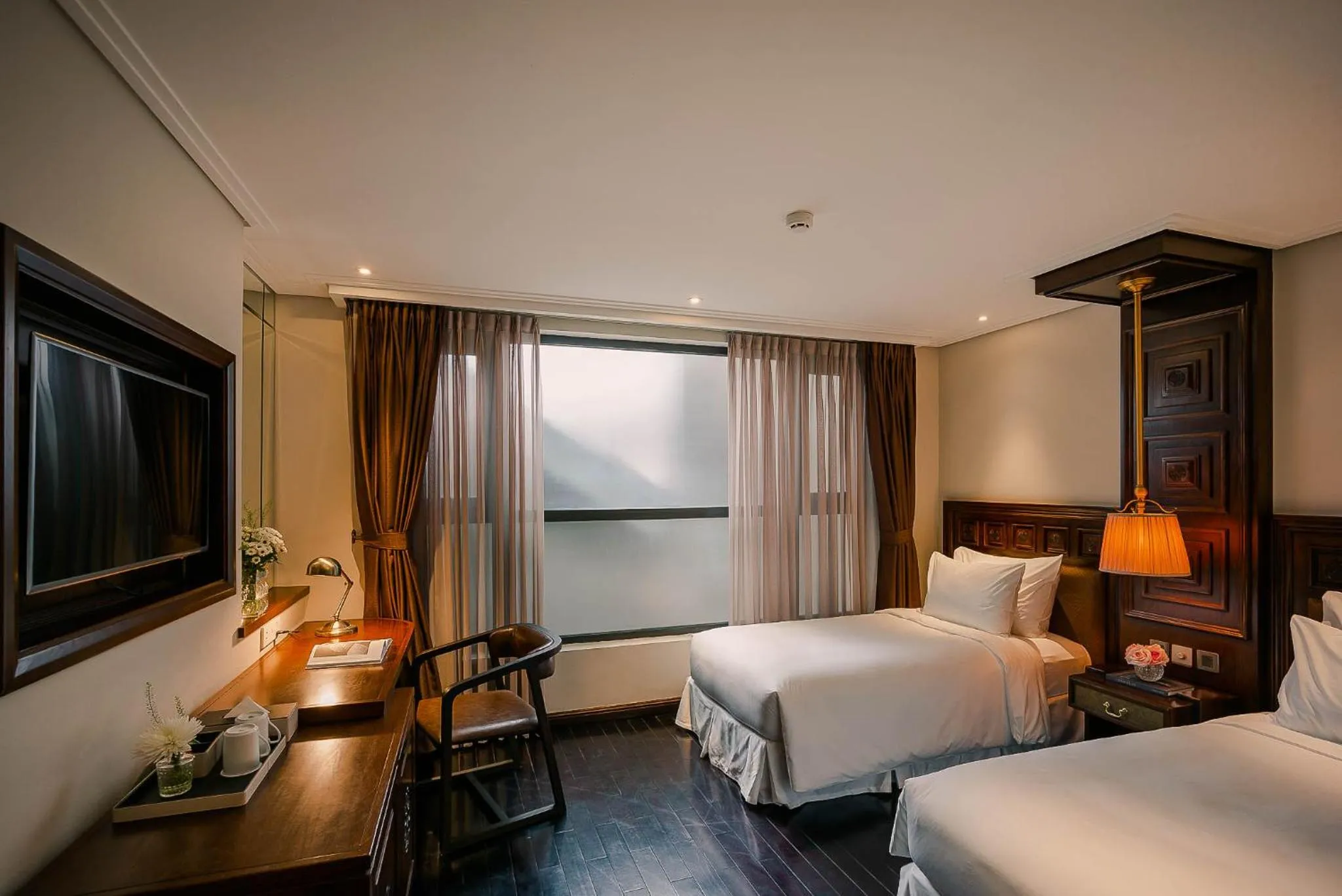 Bed in Le Jardin Hotel Haute Couture