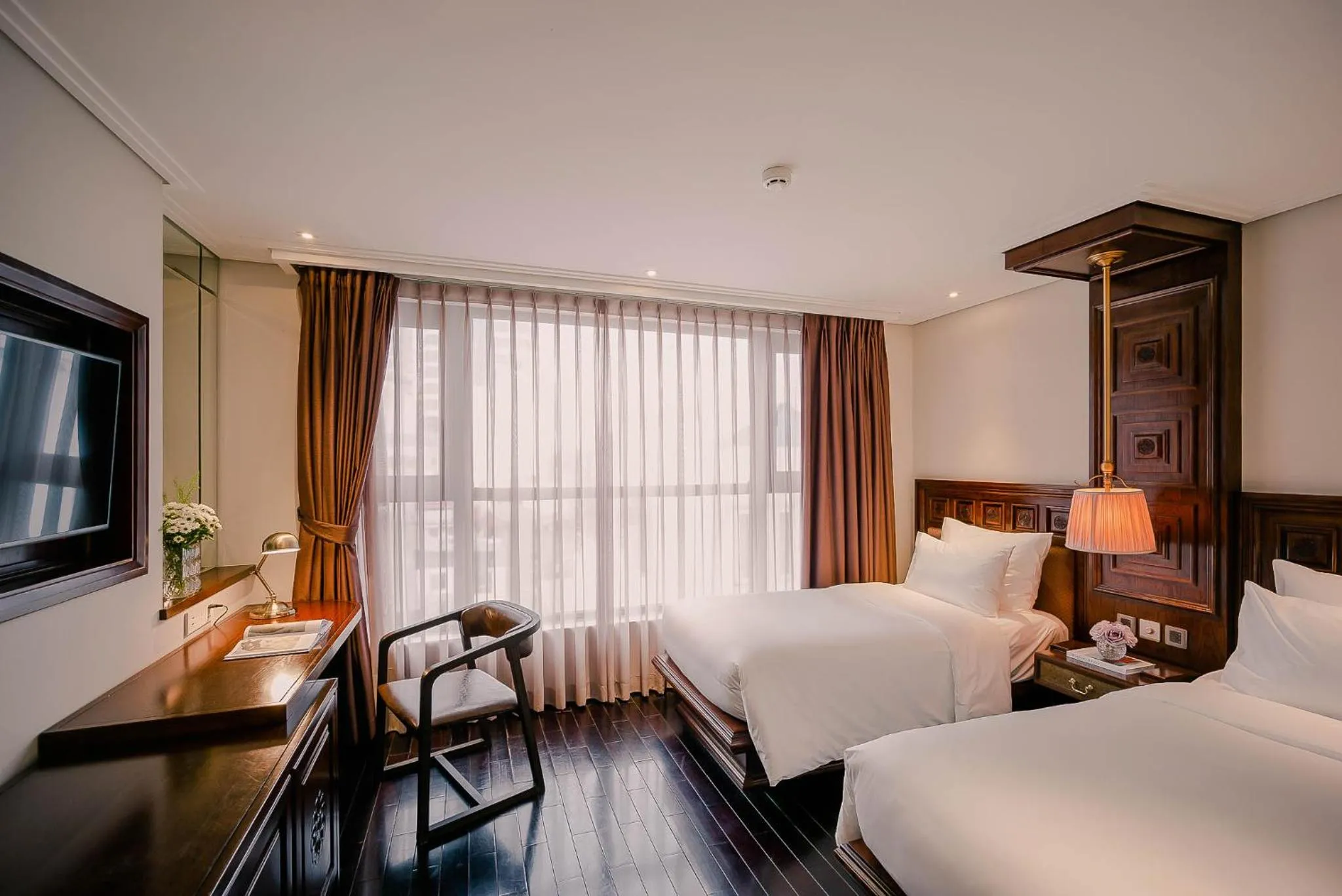 Bed in Le Jardin Hotel Haute Couture