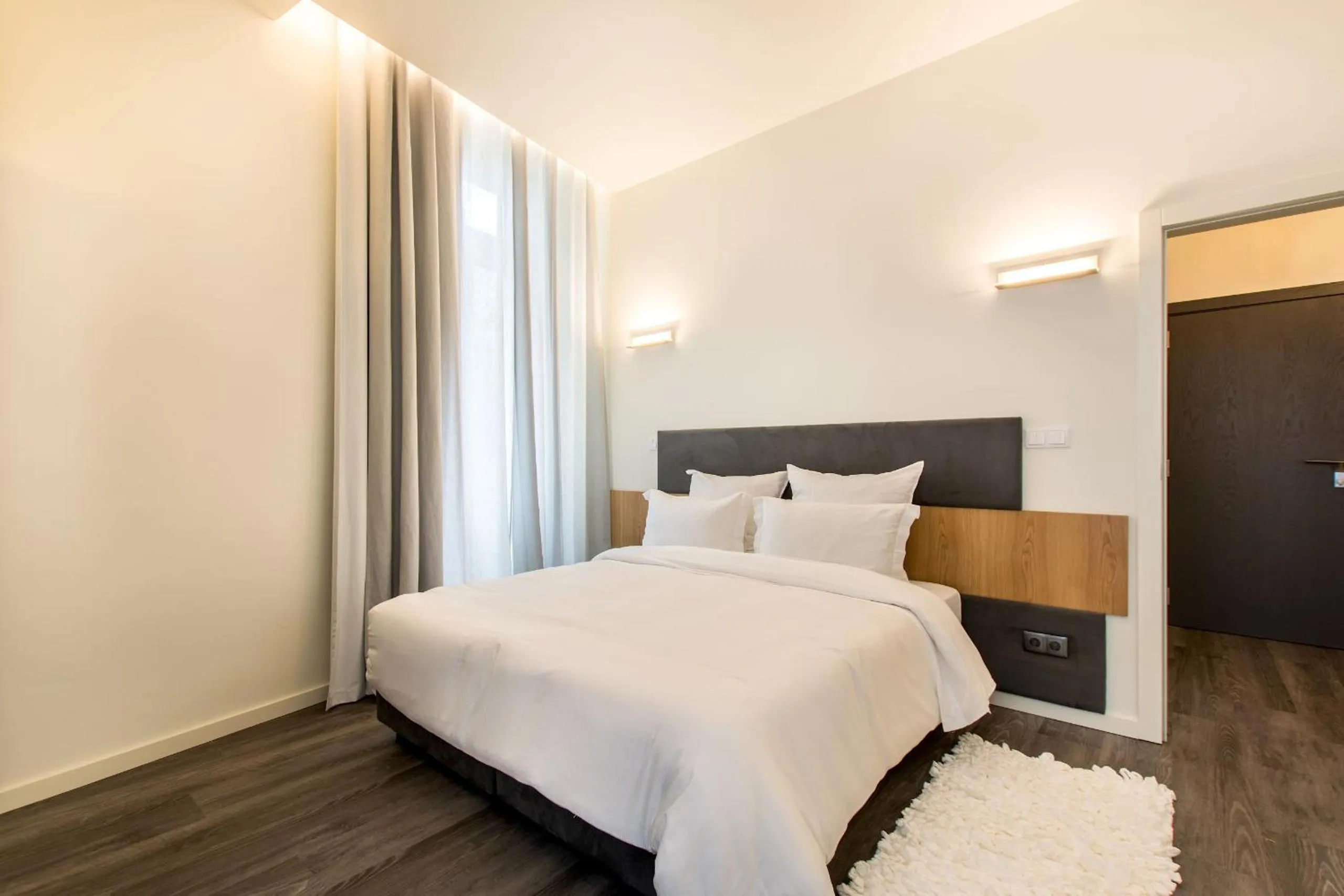 Bed in LETHESHOME Apartments