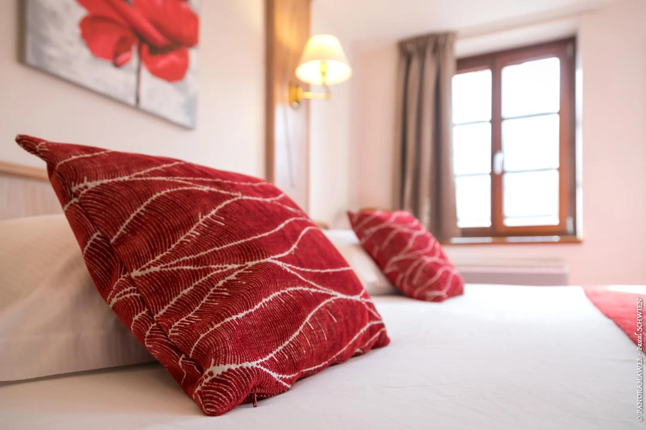 Bed in Logis Hôtel De La Cloche