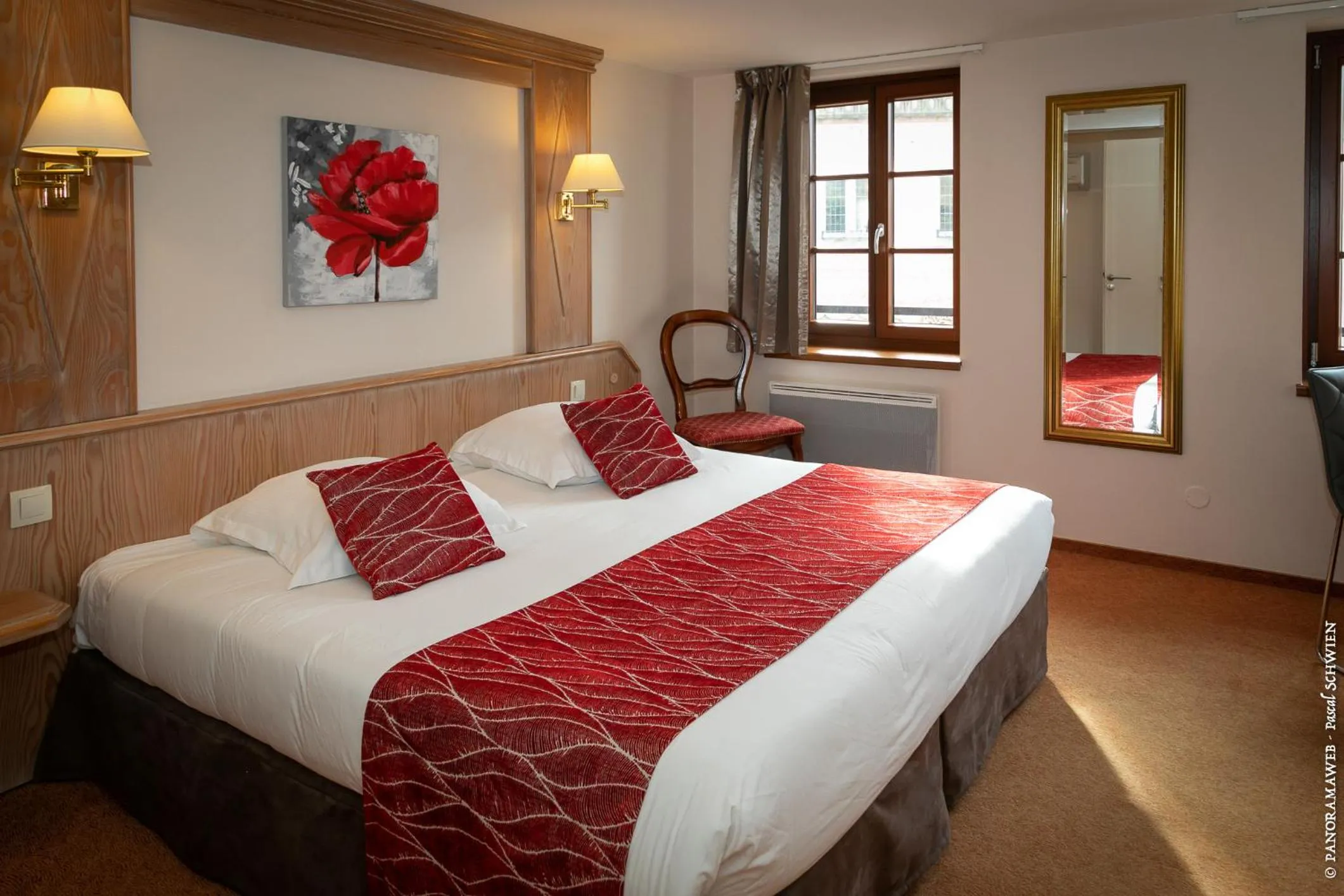 Bed in Logis Hôtel De La Cloche