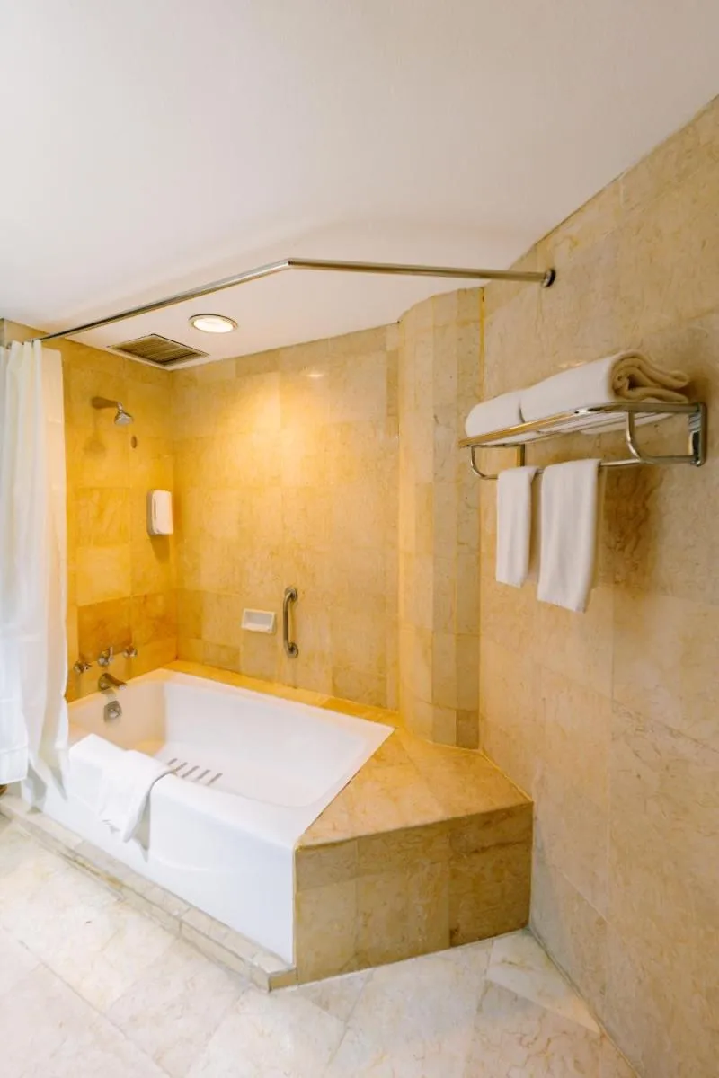Bathroom, Bed in Grand Diamond Hotel Yogyakarta
