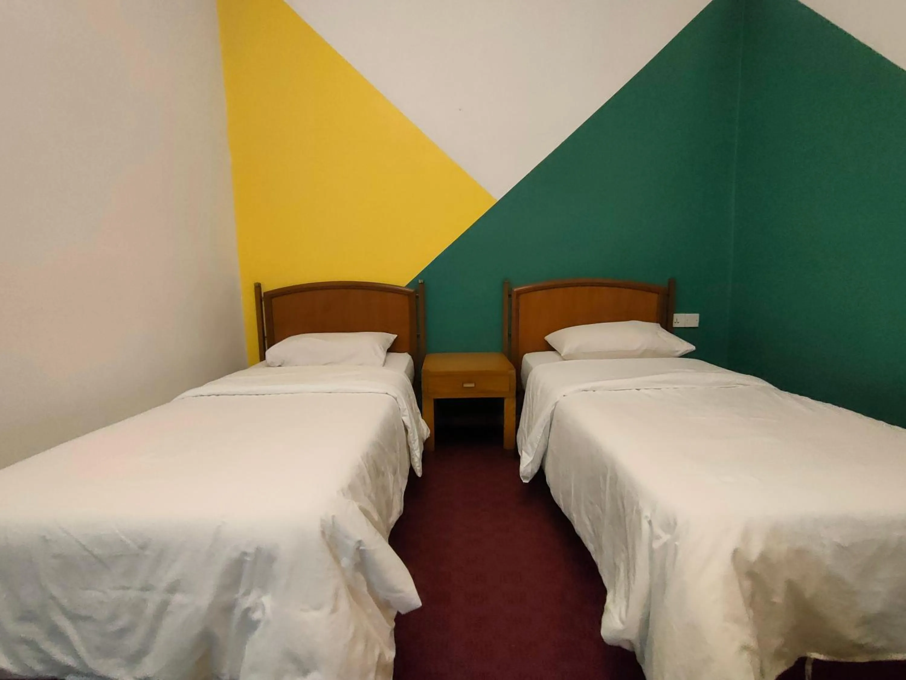 Bed in Heeren Inn Melaka