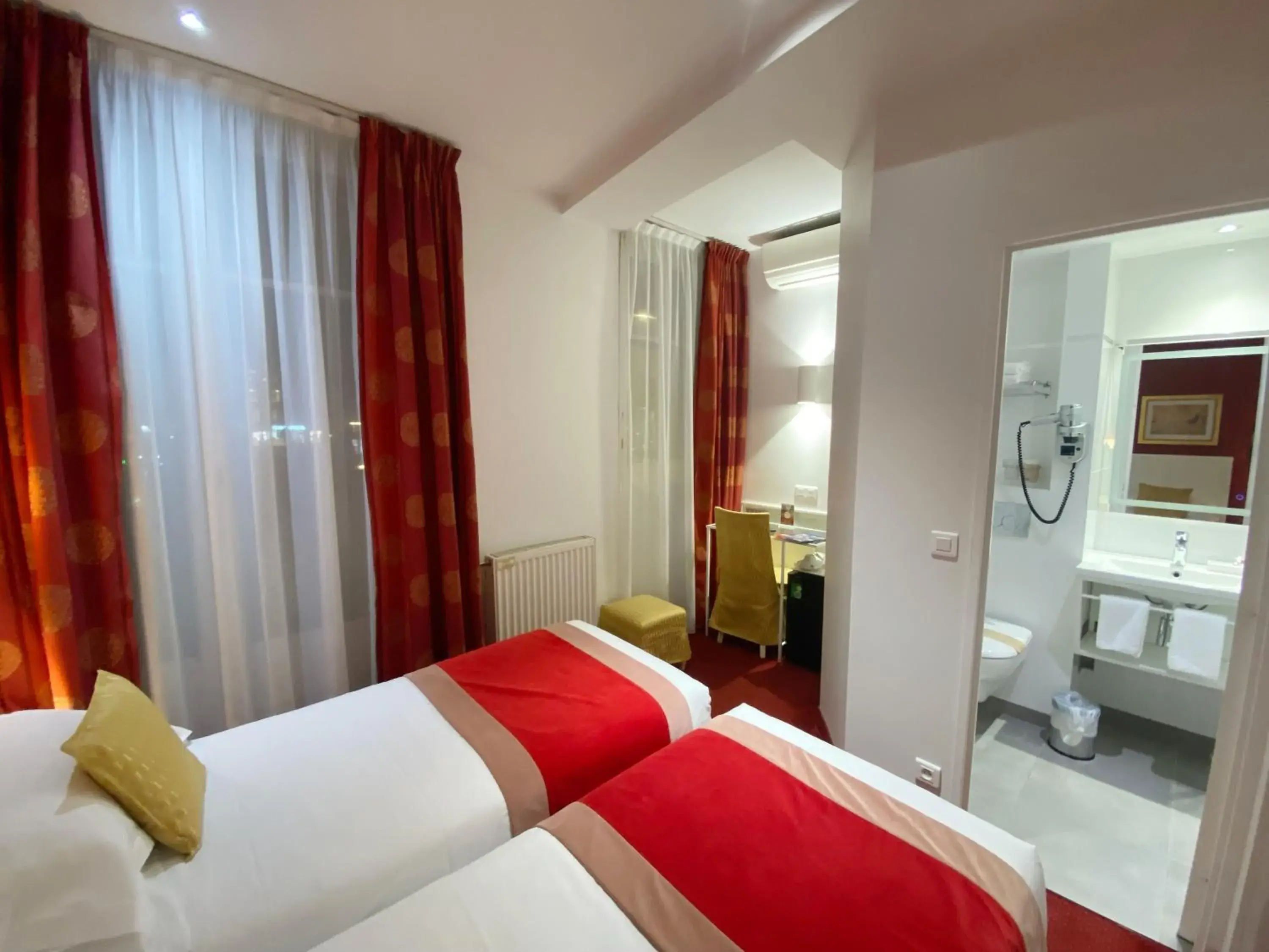 Toilet, Bed in Austin's Saint Lazare Hotel Toilet, Bed in Austin's Saint Lazare Hotel