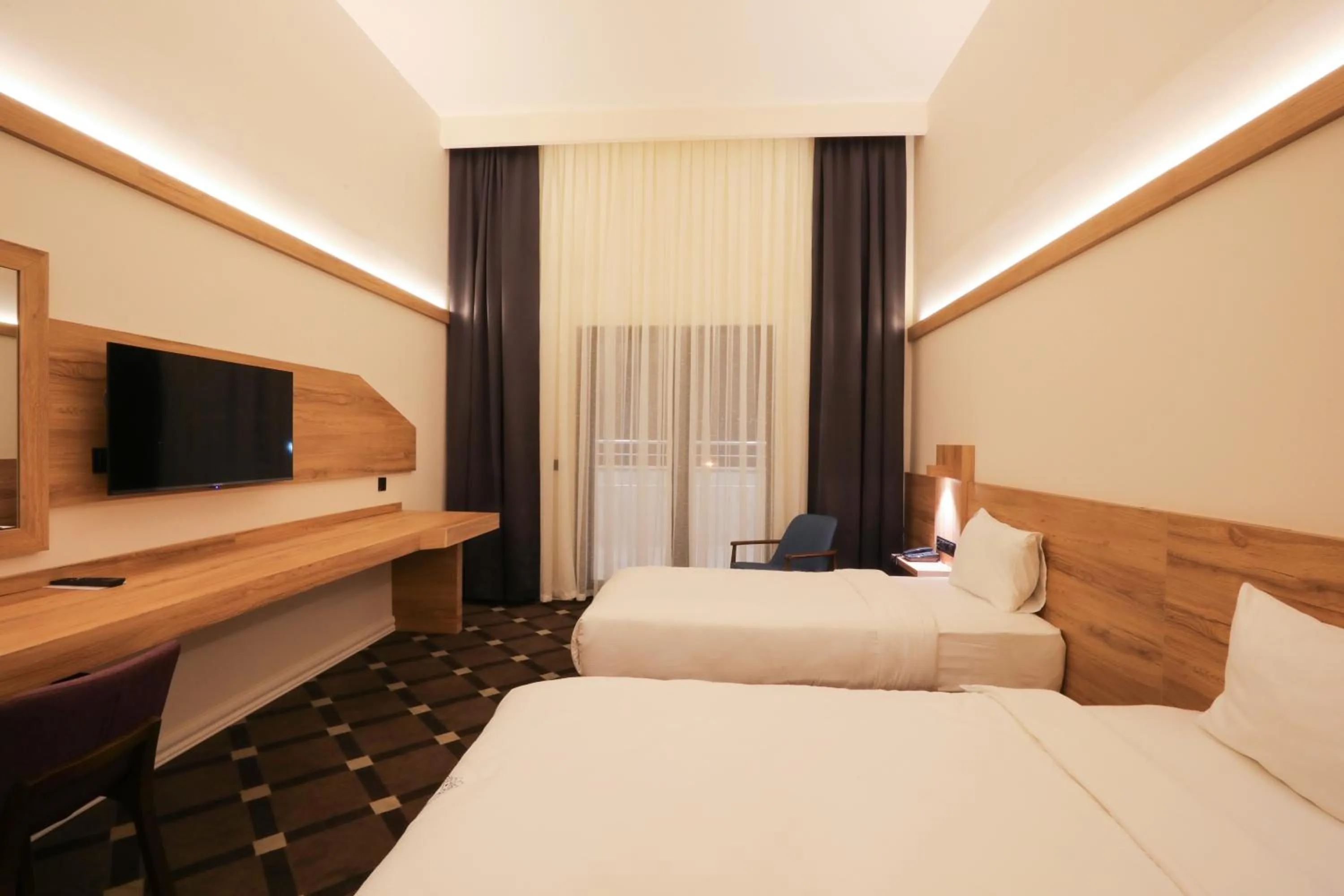 Bed in Karpalas City Hotel & Spa