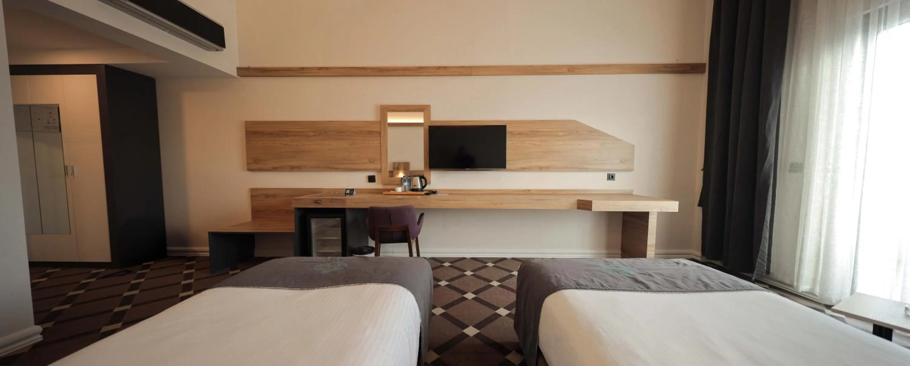 Bed in Karpalas City Hotel & Spa