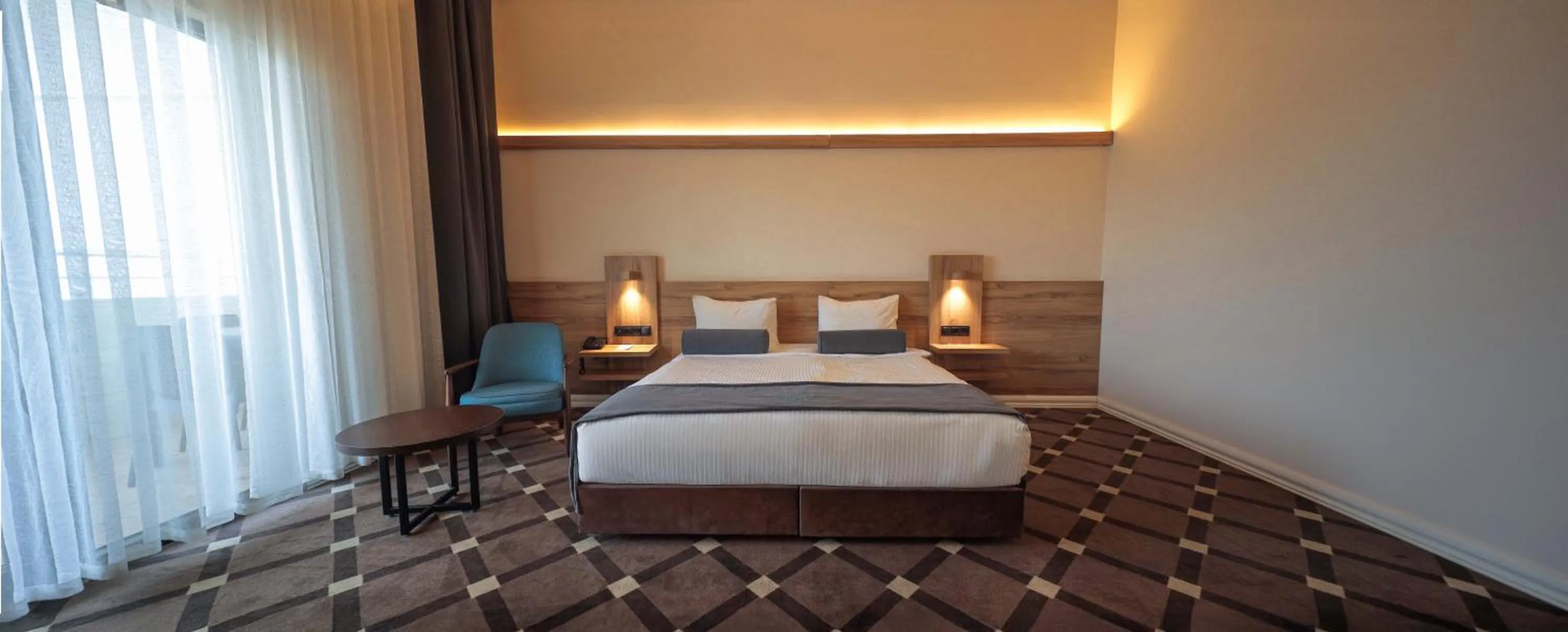 Bed in Karpalas City Hotel & Spa