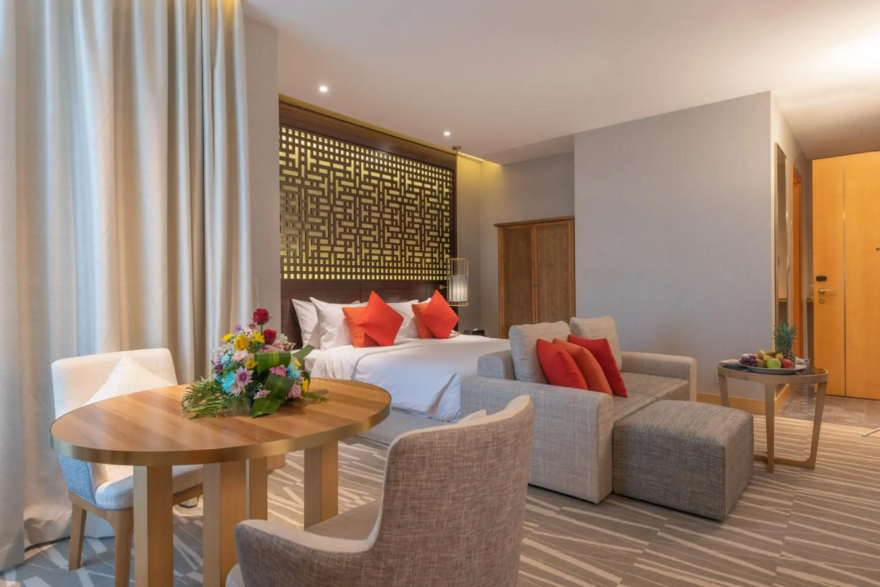 Seating area, Bed in Ramada Hotel & Suites by Wyndham Al Qassim Seating area, Bed in Ramada Hotel & Suites by Wyndham Al Qassim