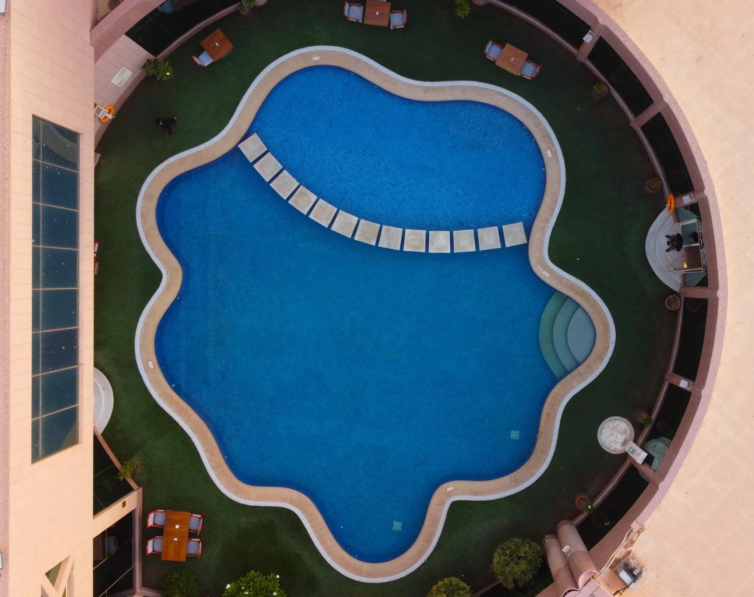 Swimming pool in Ramada Hotel & Suites by Wyndham Al Qassim