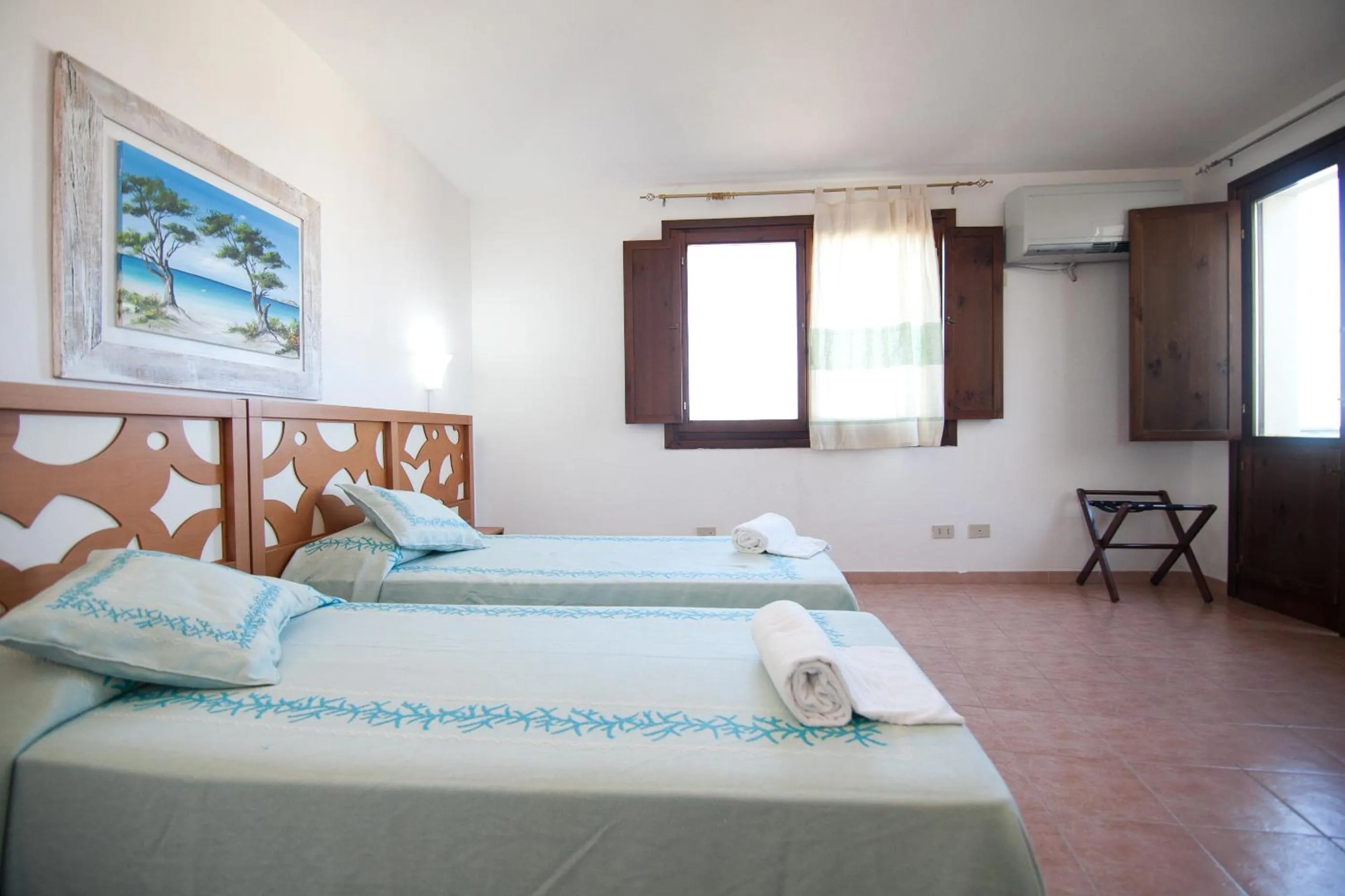 Photo of the whole room, Bed in Club Esse Gallura
