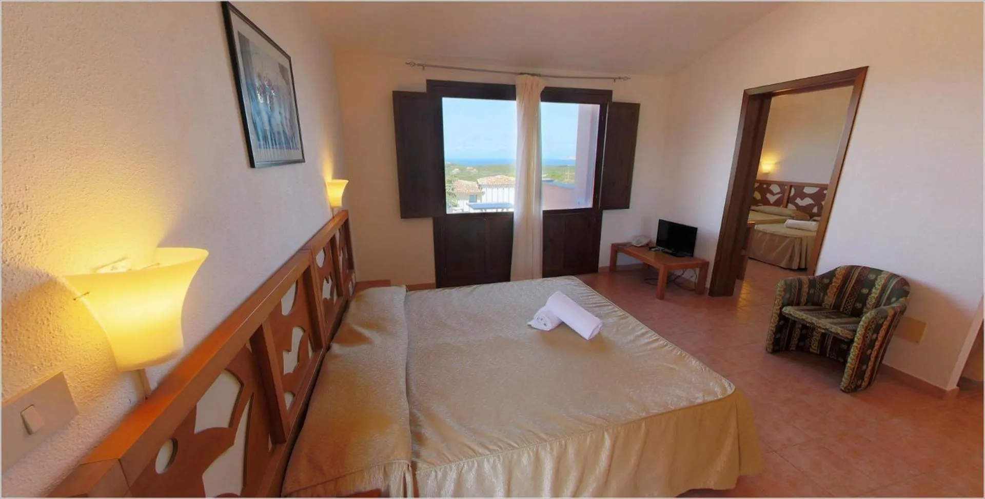 Photo of the whole room, Bed in Club Esse Gallura