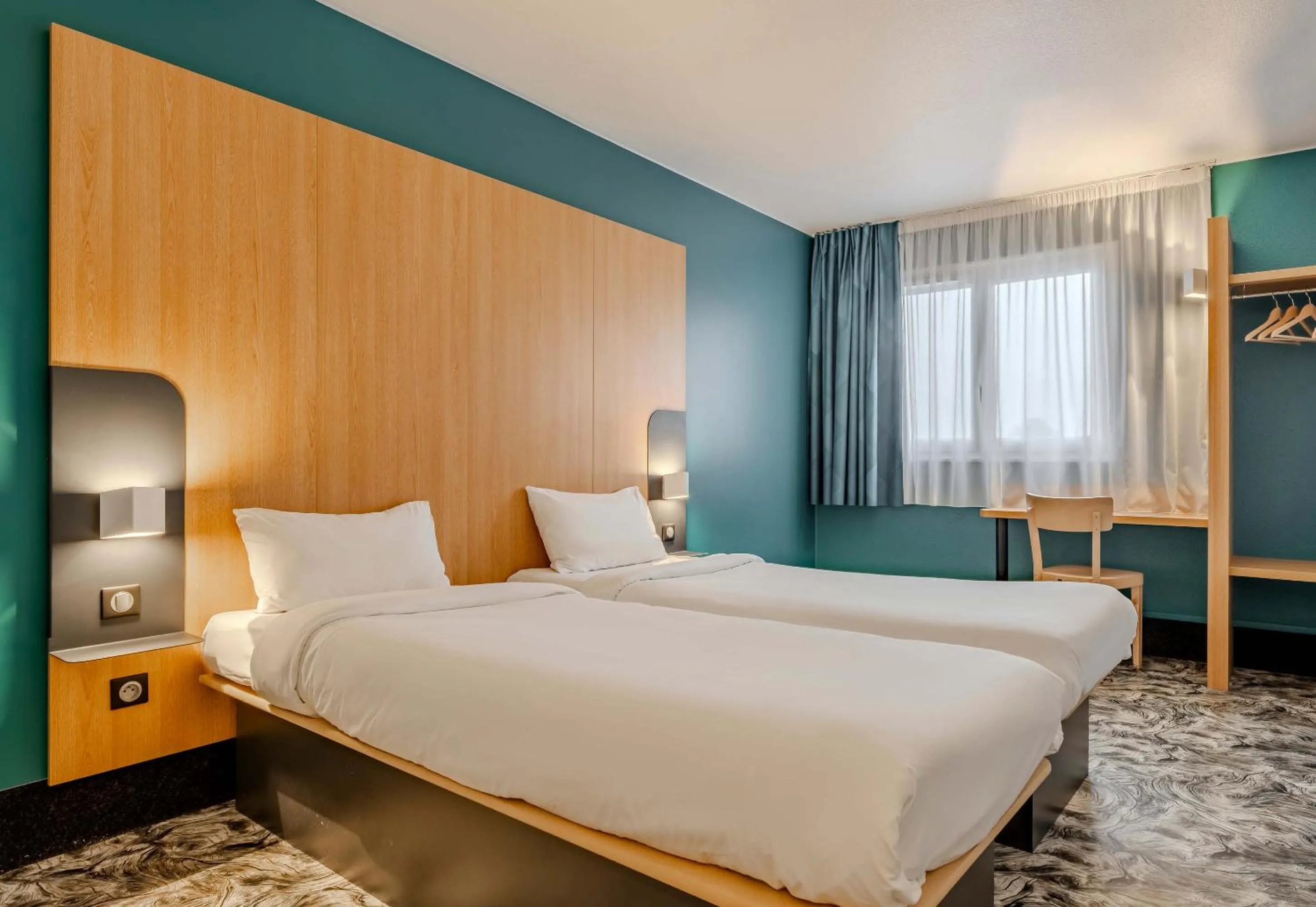 Bed in B&B HOTEL Maubeuge-Louvroil