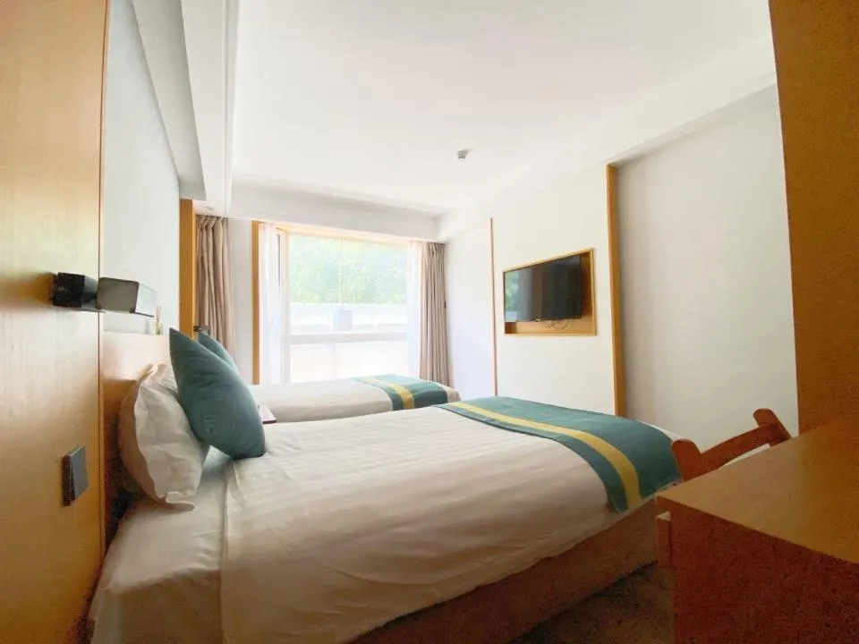 Bed in Beijing RJ Brown city center hotel Forbidden City &Tian'anmen Square ,Near Subway line 8, 3min walk to Temple of Heaven, English Speaking reception , Laundry service ,Free wifi ,Oneday tour to Greatwall