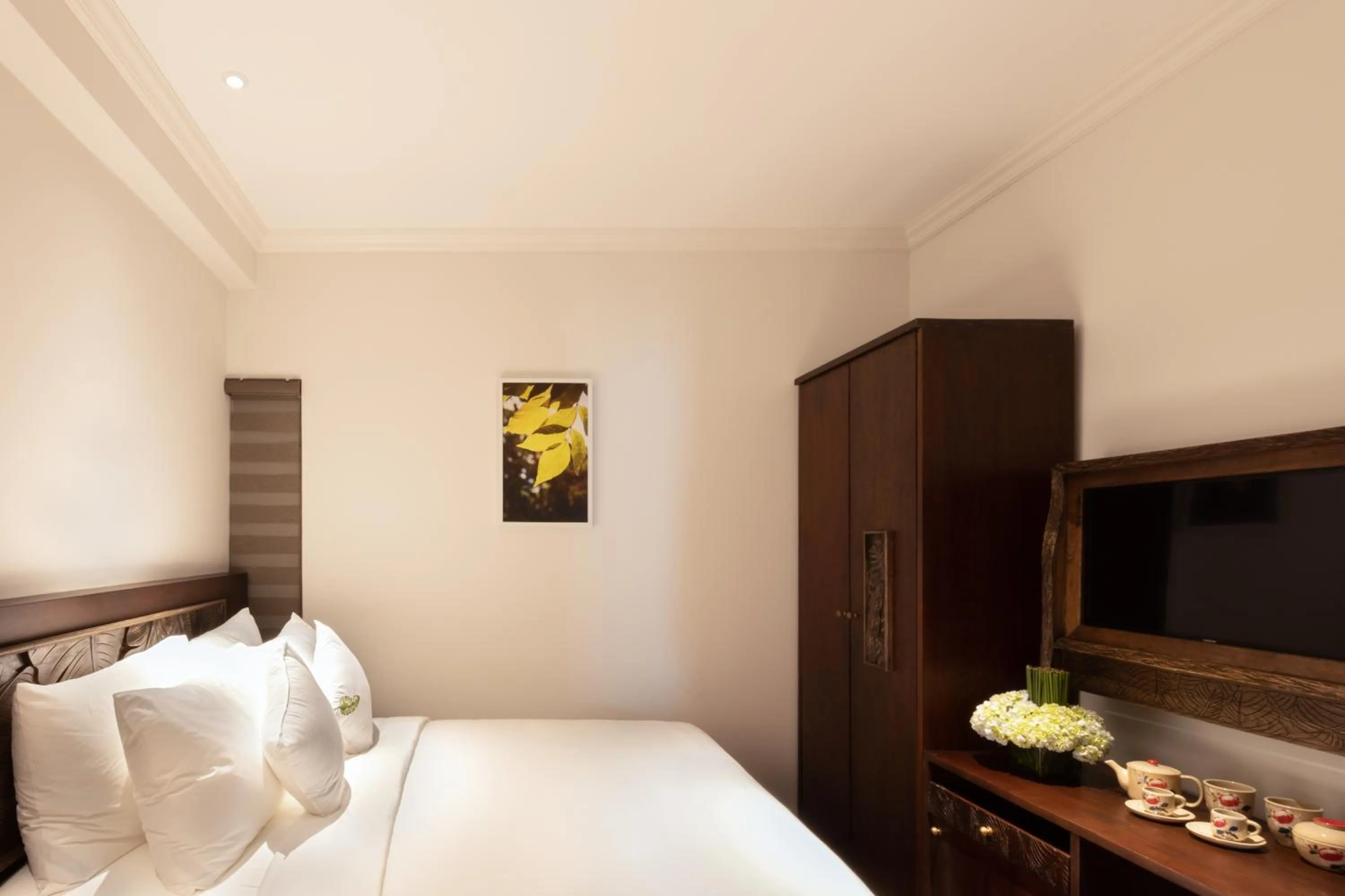 Bed in Cochin Sang Hotel