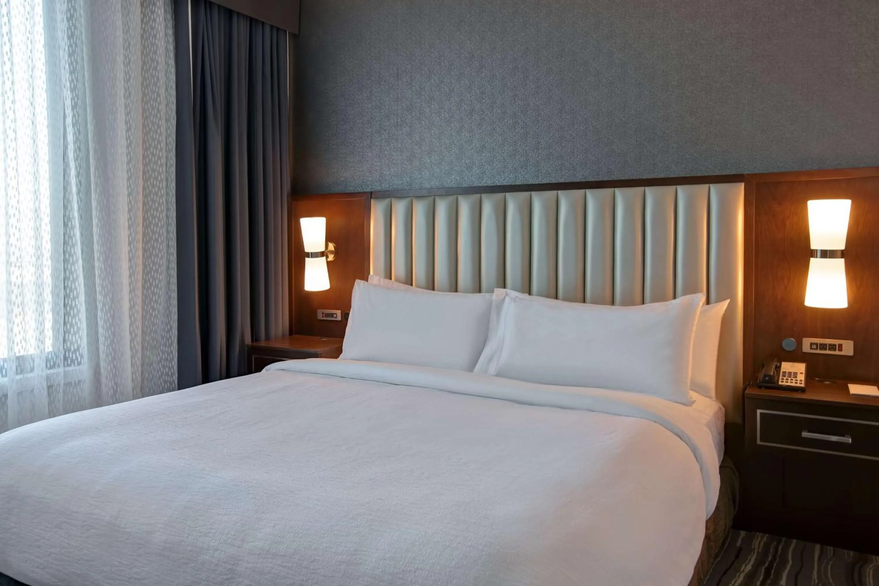 Bed in Embassy Suites Syracuse