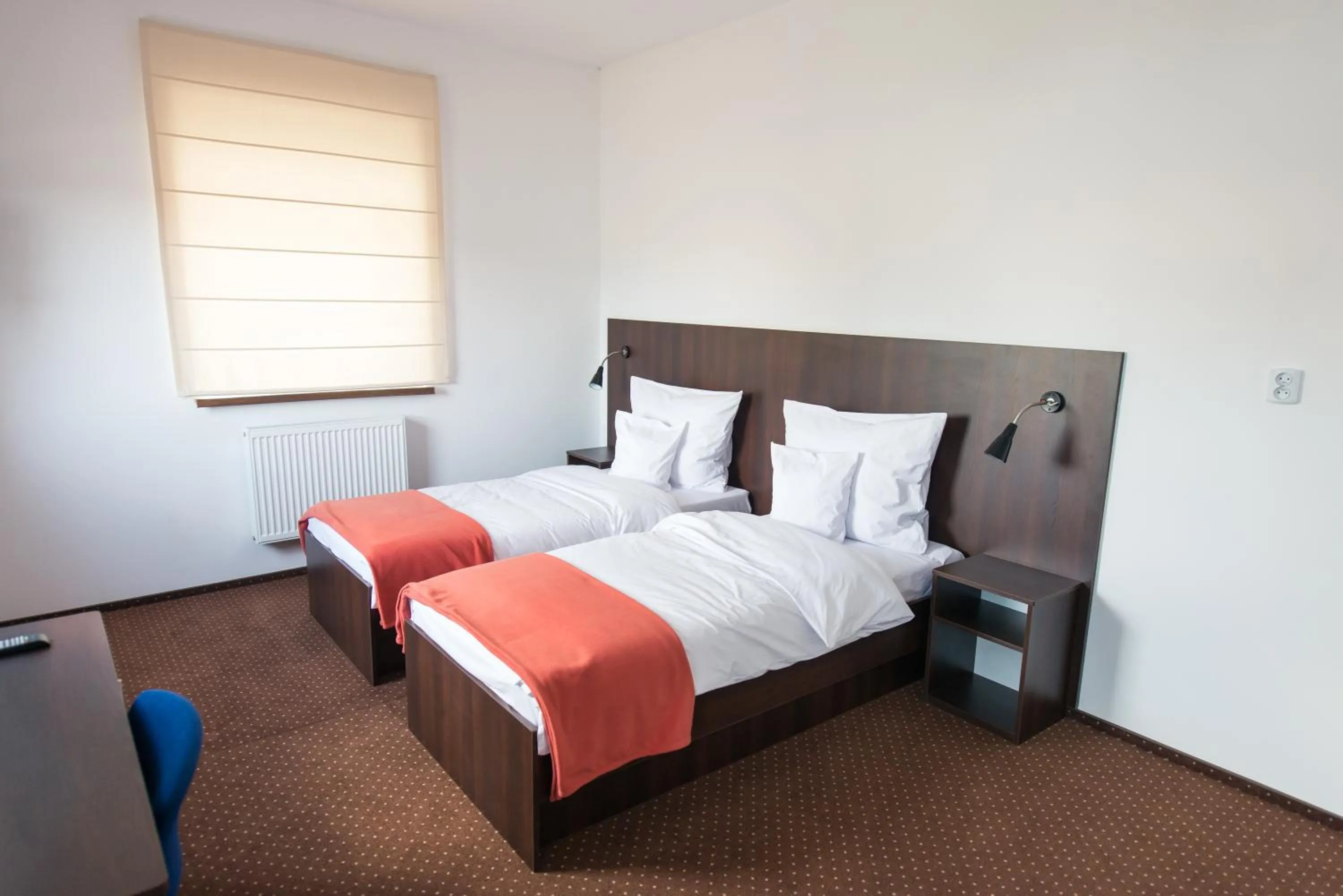 Photo of the whole room, Bed in First Hotel