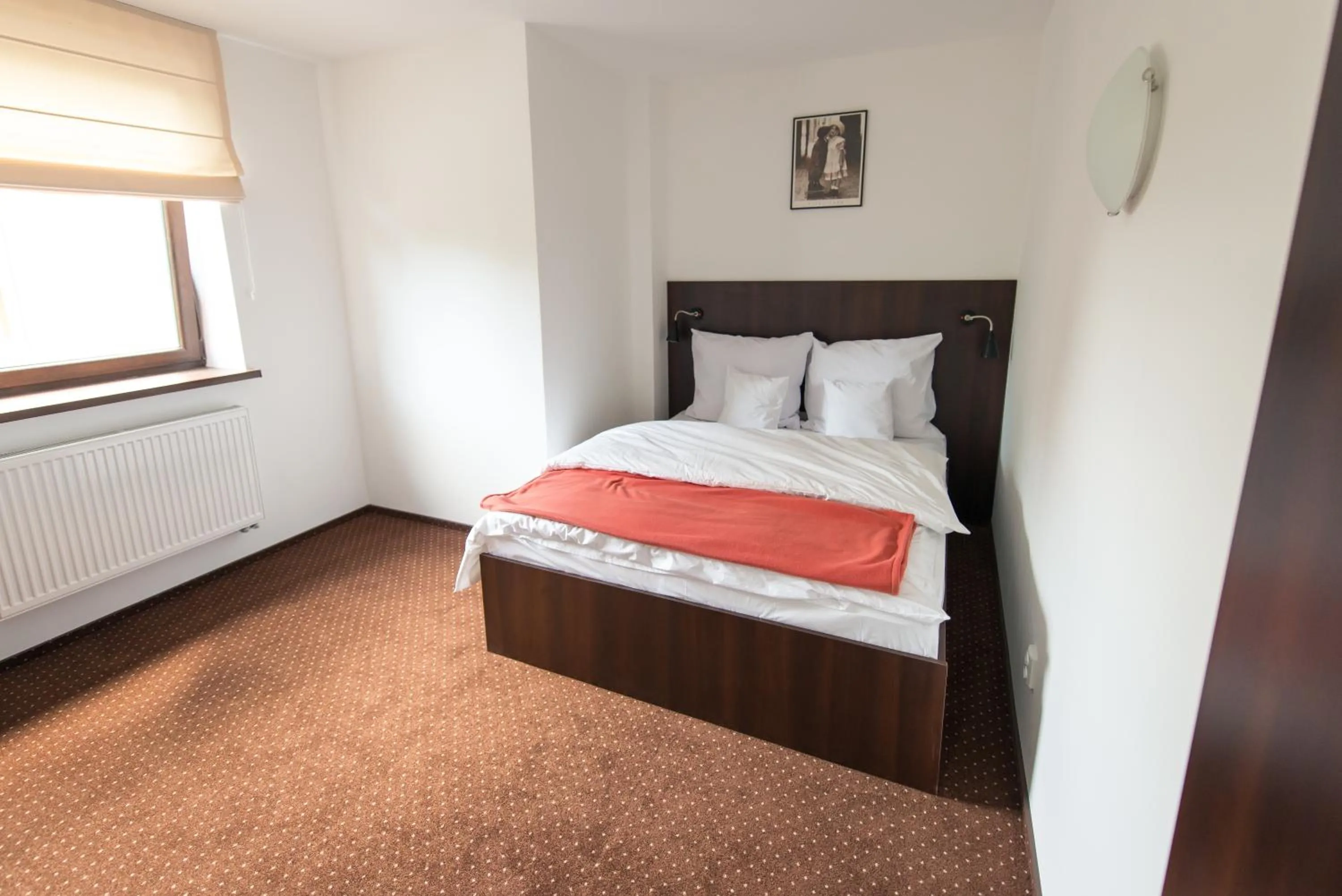 Photo of the whole room, Bed in First Hotel