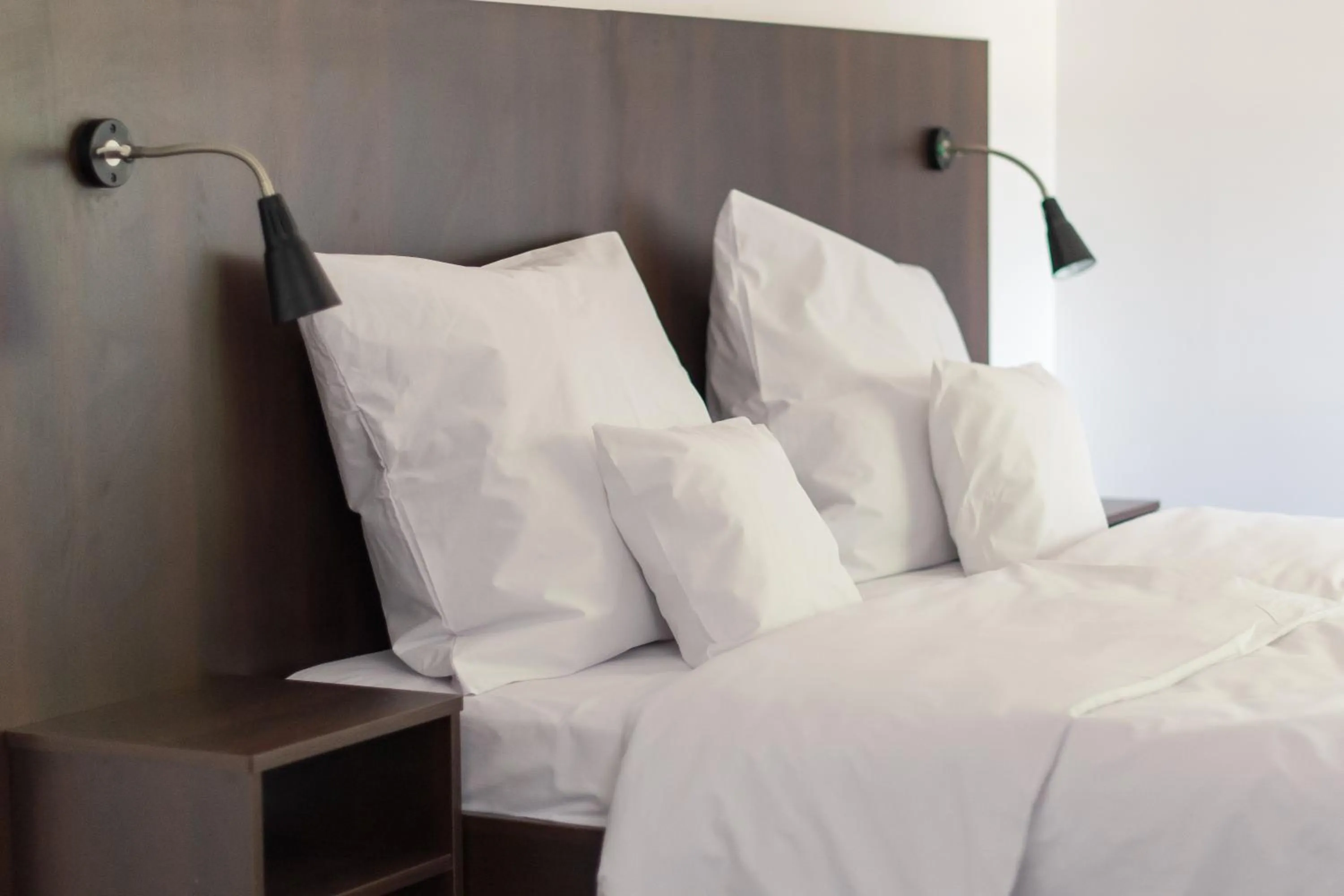 Photo of the whole room, Bed in First Hotel