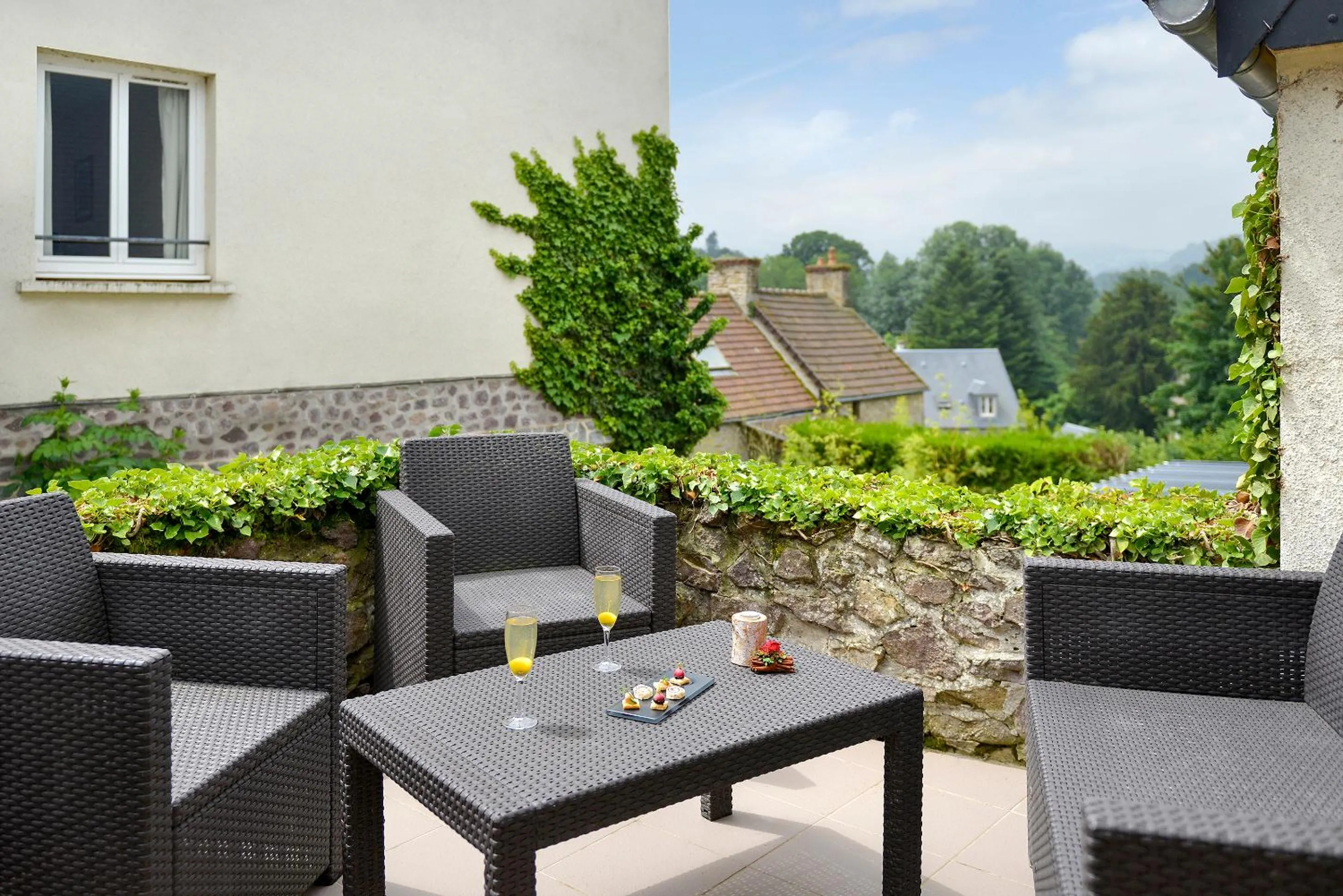 Patio in Logis Hotel Spa Restaurant Au Site Normand
