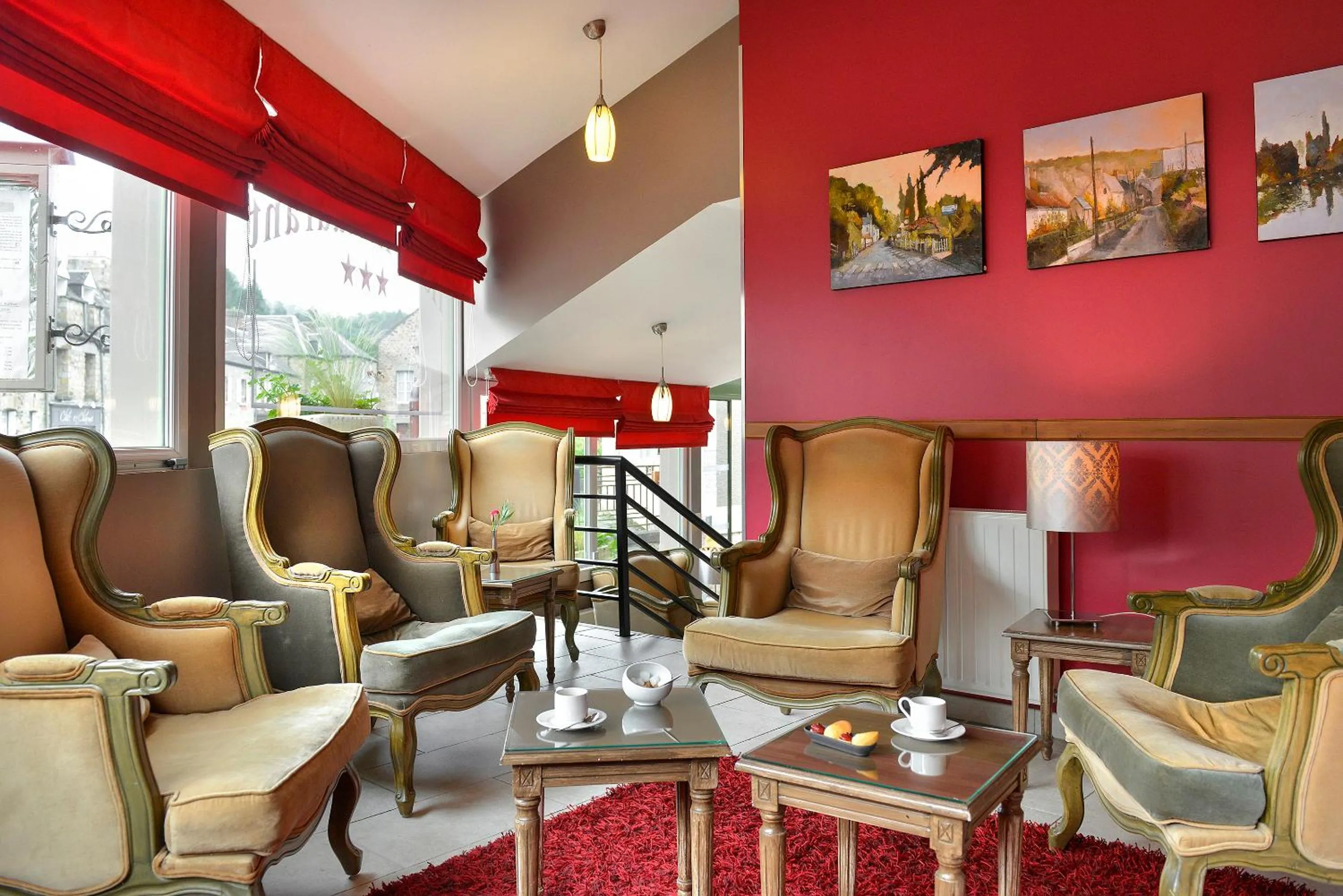 Communal lounge/ TV room in Logis Hotel Spa Restaurant Au Site Normand