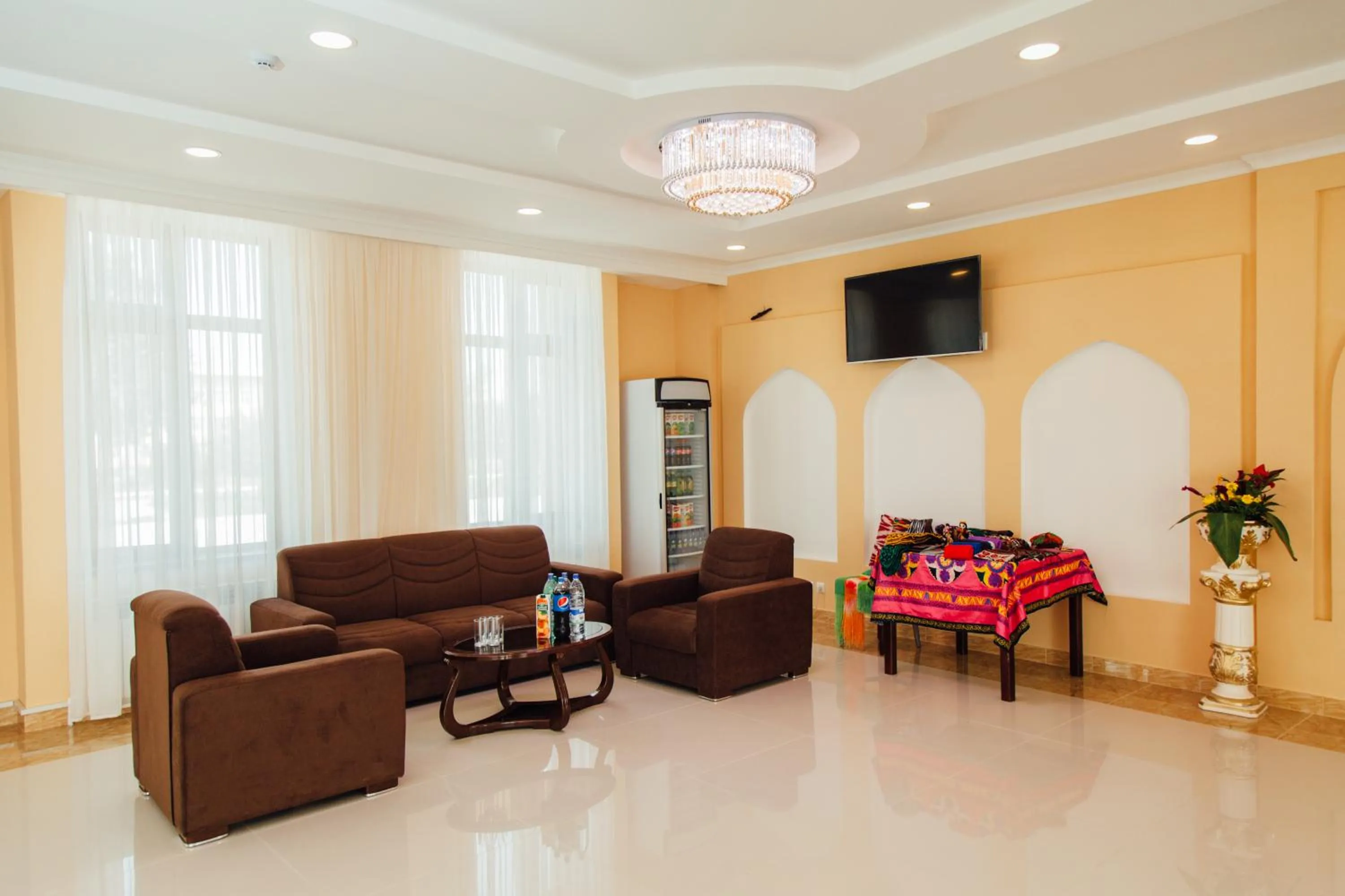 Communal lounge/ TV room in Bek Khiva Hotel