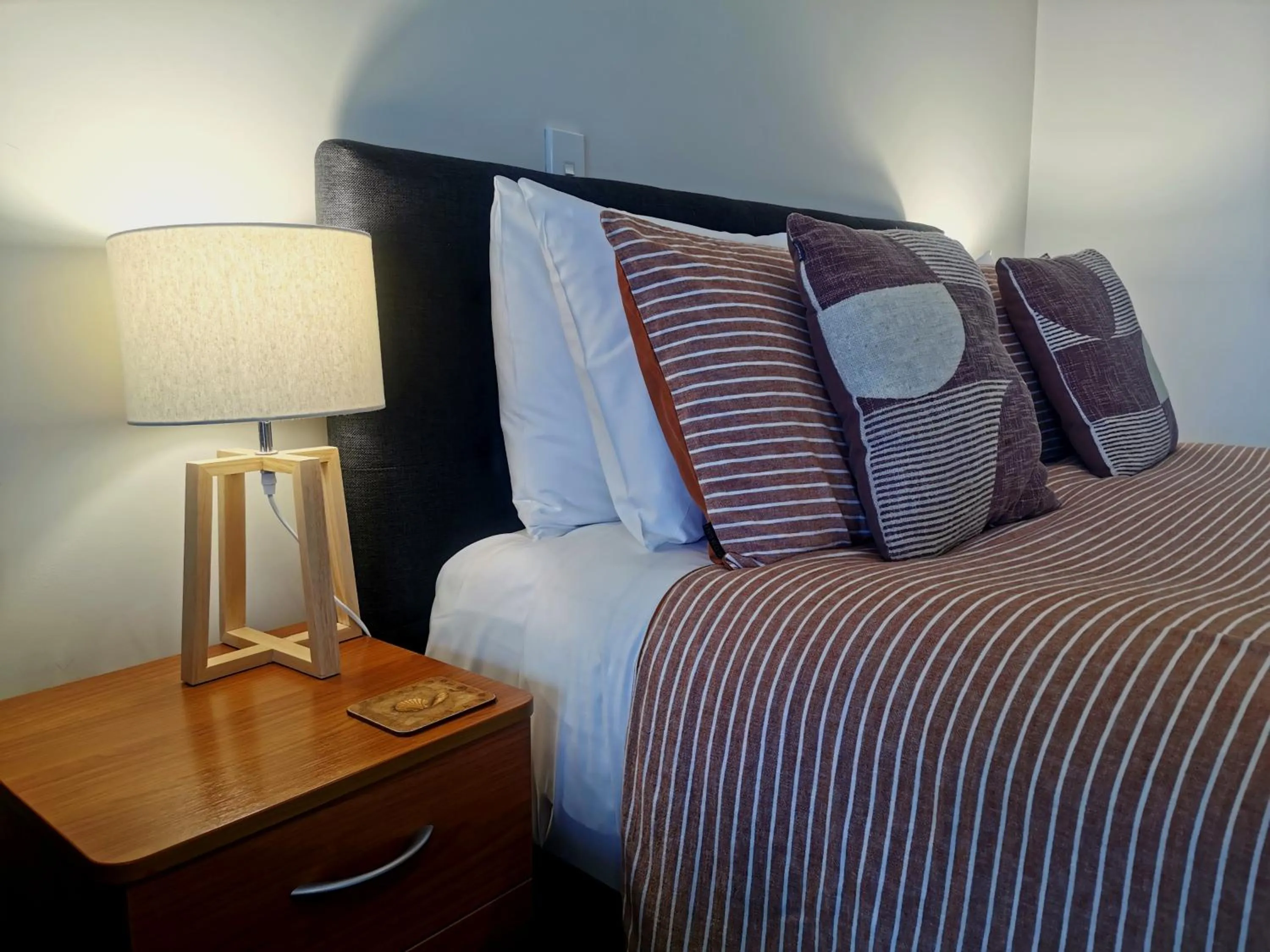 Bed in ASURE Ascot Motor Inn